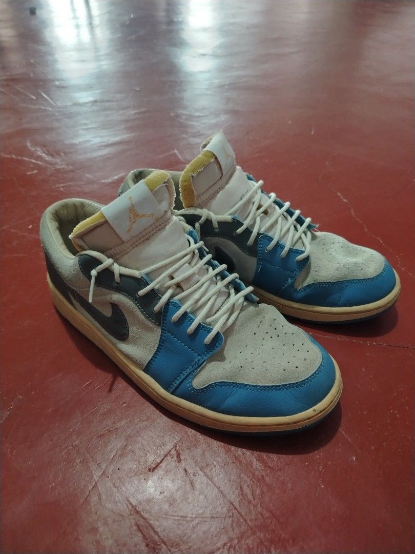 Air Jordan 1 Low UNC (Category: Sneakers) located in Roxas City. Submitted by hd_thriftshop (Listing ID 1420814281, Image 1). Description: - Air Jordan 1 Low - Color: Blue, White, Yellow - Size: US 9 - Features: Blue outsole, white midsole, Nike swoosh - Made in Vietnam.