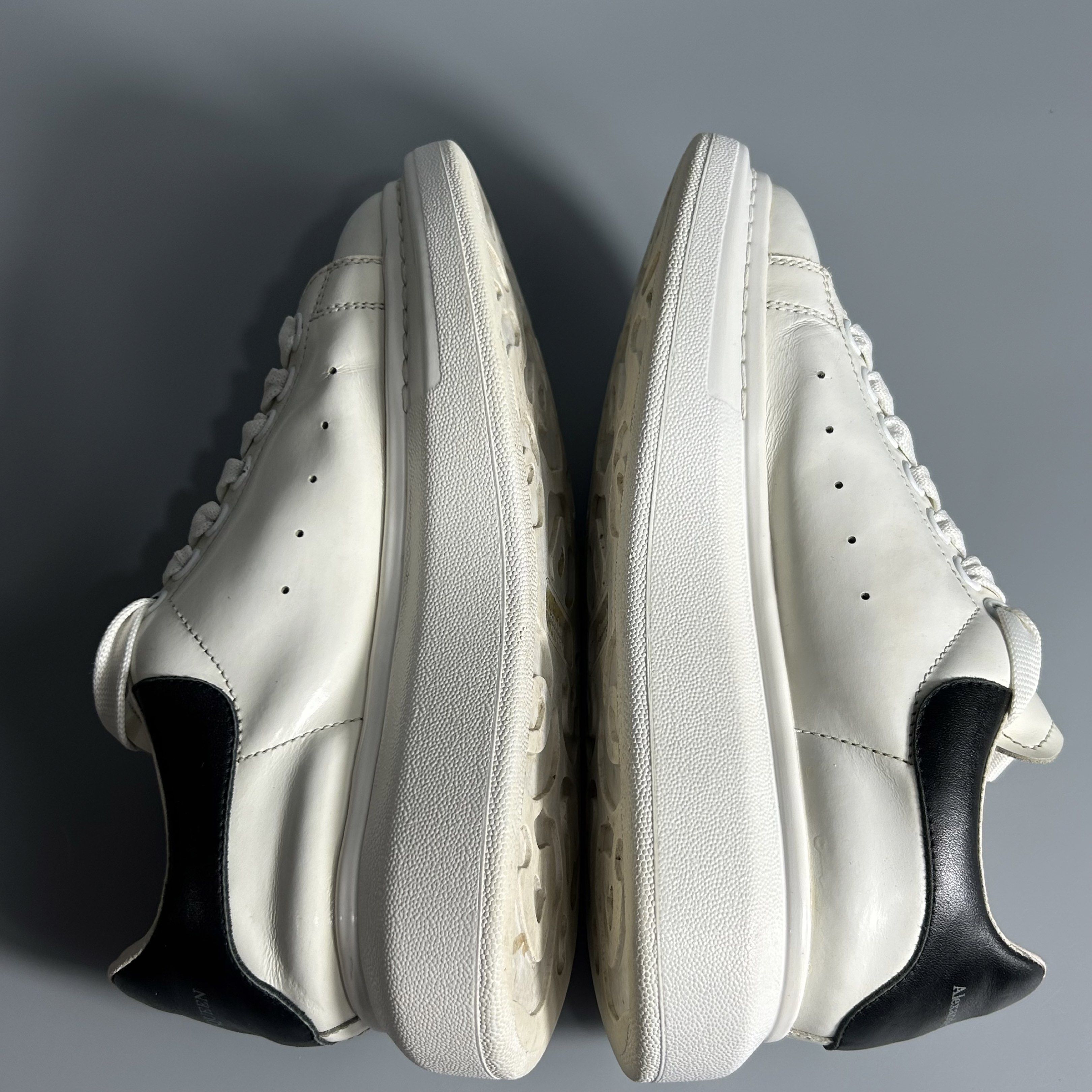 Alexander McQueen Motor City Sneakers (Category: Sneakers) located in Cavite. Submitted by datsoretro (Listing ID 1420927171, Image 2). Description: - Alexander McQueen sneakers - White with black accents - "Motor City" design - Size 38 D - Made in Italy - Some wear on soles - Alexander McQueen logo present.