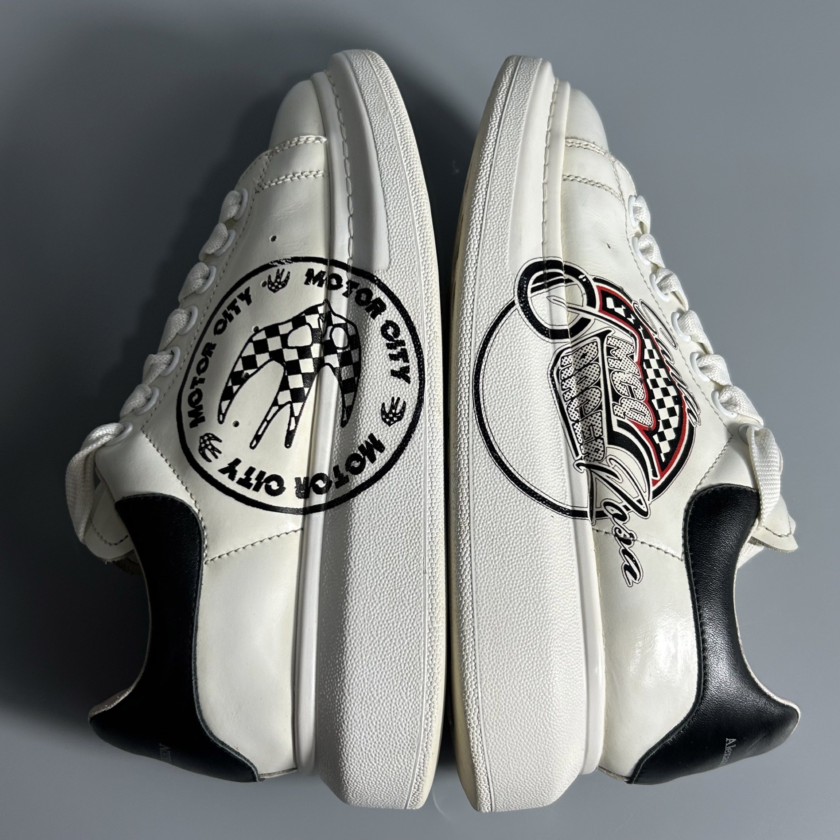 Alexander McQueen Motor City Sneakers (Category: Sneakers) located in Cavite. Submitted by datsoretro (Listing ID 1420927171, Image 3). Description: - Alexander McQueen sneakers - White with black accents - "Motor City" design - Size 38 D - Made in Italy - Some wear on soles - Alexander McQueen logo present.