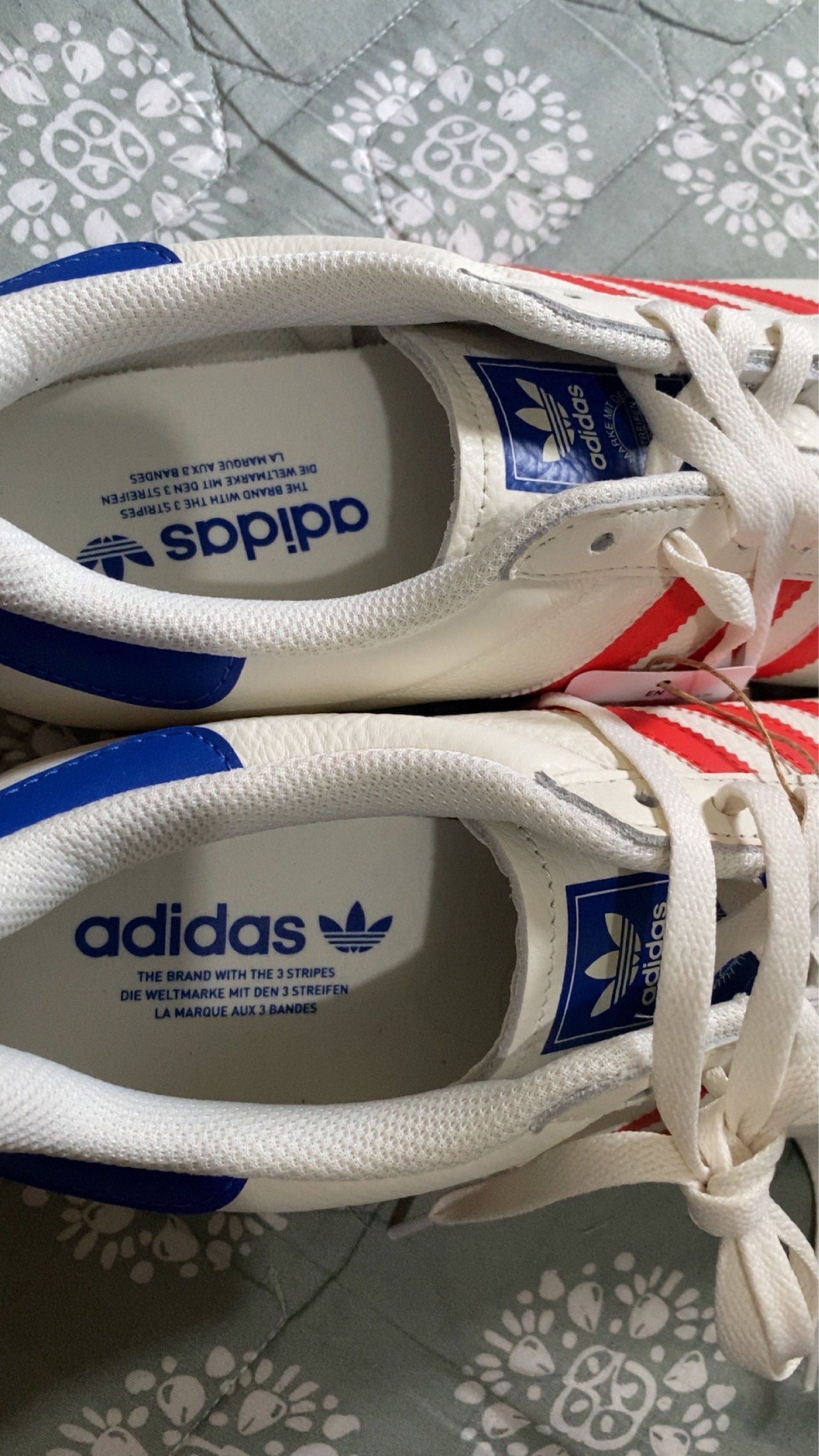 Authentic Adidas K74 Sneakers White Red Blue (Category: Sneakers) located in Manila. Submitted by maeee_eee (Listing ID 1420837489, Image 2). Description: NEGOTIABLE!! ORIGINAL!! BRAND NEW bought from australia - Adidas K74 sneakers - White with red stripes and blue accents - Adidas logo on tongue and insole - Includes original tags - White leather upper - Suede toe cap - super comfy according to reviews.