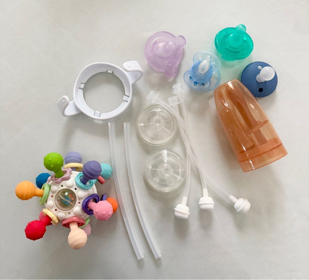 Baby Bottle Accessories and Teether TAKE ALL (Category: Infant Playtime) located in Taguig. Submitted by misskyleee (Listing ID 1420884493, Image 1). Description: - Includes various baby bottle accessories: nipples, straws, and bottle handle. - Also includes a colorful teether toy. - Items are clean and ready for use. - Perfect for replacement parts or additional accessories..
