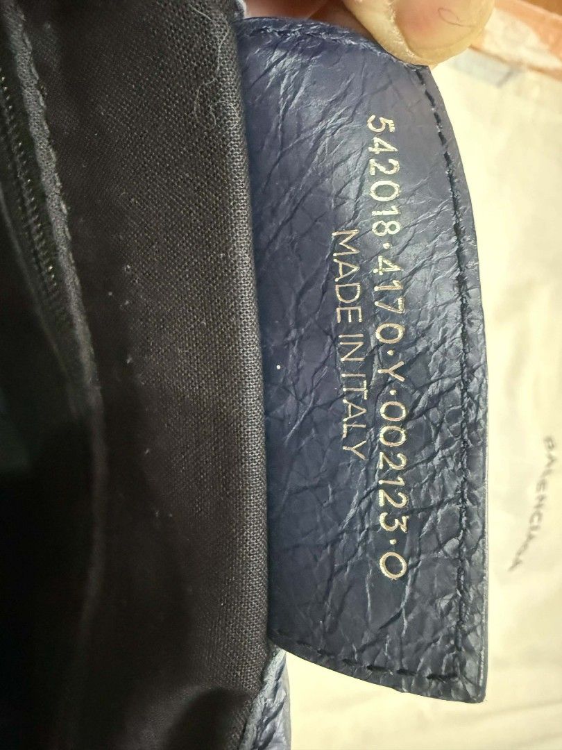 Balenciaga Navy Leather Handbag (Category: Luxury Bags & Wallets) located in Caloocan City. Submitted by fiercestone-c8e70e (Listing ID 1420788675, Image 3). Description: Authentic Balenciaga handbag in navy blue leather. Features top handle, detachable shoulder strap, and zipper closure. Includes dust bag. Made in Italy..