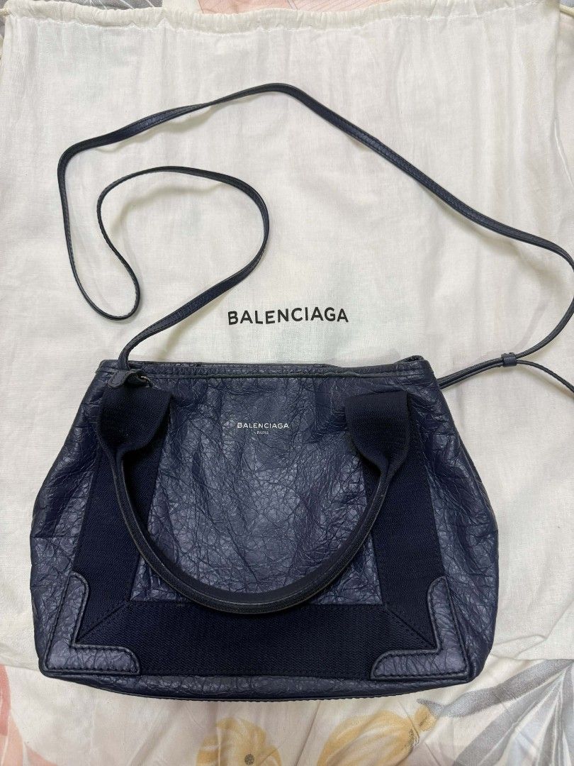 Balenciaga Navy Leather Handbag (Category: Luxury Bags & Wallets) located in Caloocan City. Submitted by fiercestone-c8e70e (Listing ID 1420788675, Image 2). Description: Authentic Balenciaga handbag in navy blue leather. Features top handle, detachable shoulder strap, and zipper closure. Includes dust bag. Made in Italy..