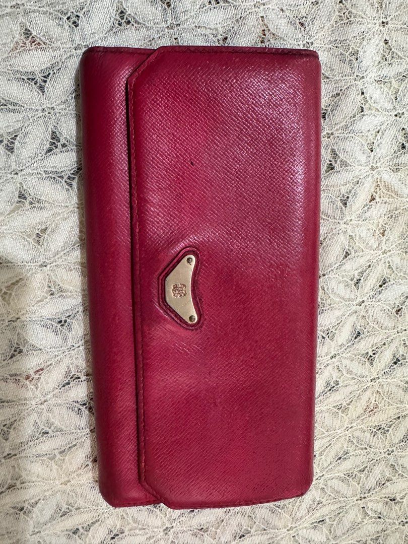 Bruno Magli Red Leather Wallet (Category: Wallets & Card holders) located in Rizal. Submitted by darcybarlowe (Listing ID 1420855153, Image 1). Description: all leather, faded red, inside loks new.