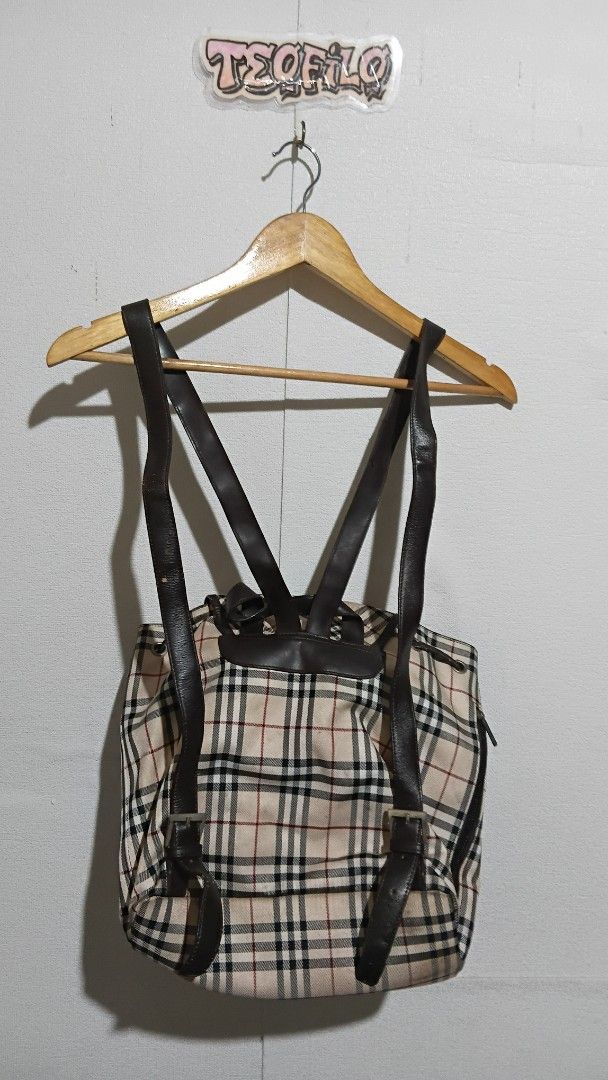 Burberry Checkered Backpack (Category: Luxury Bags & Wallets) located in Santo Tomas. Submitted by teofilo-thrifted (Listing ID 1420771920, Image 3). Description: - Authentic Burberry backpack - Classic checkered pattern - Multiple pockets - Adjustable leather straps - Drawstring and buckle closure - Black interior lining with Burberry tag price 1000 free shipping po.