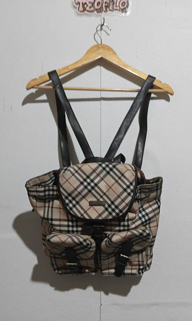 Burberry Checkered Backpack (Category: Luxury Bags & Wallets) located in Santo Tomas. Submitted by teofilo-thrifted (Listing ID 1420771920, Image 1). Description: - Authentic Burberry backpack - Classic checkered pattern - Multiple pockets - Adjustable leather straps - Drawstring and buckle closure - Black interior lining with Burberry tag price 1000 free shipping po.