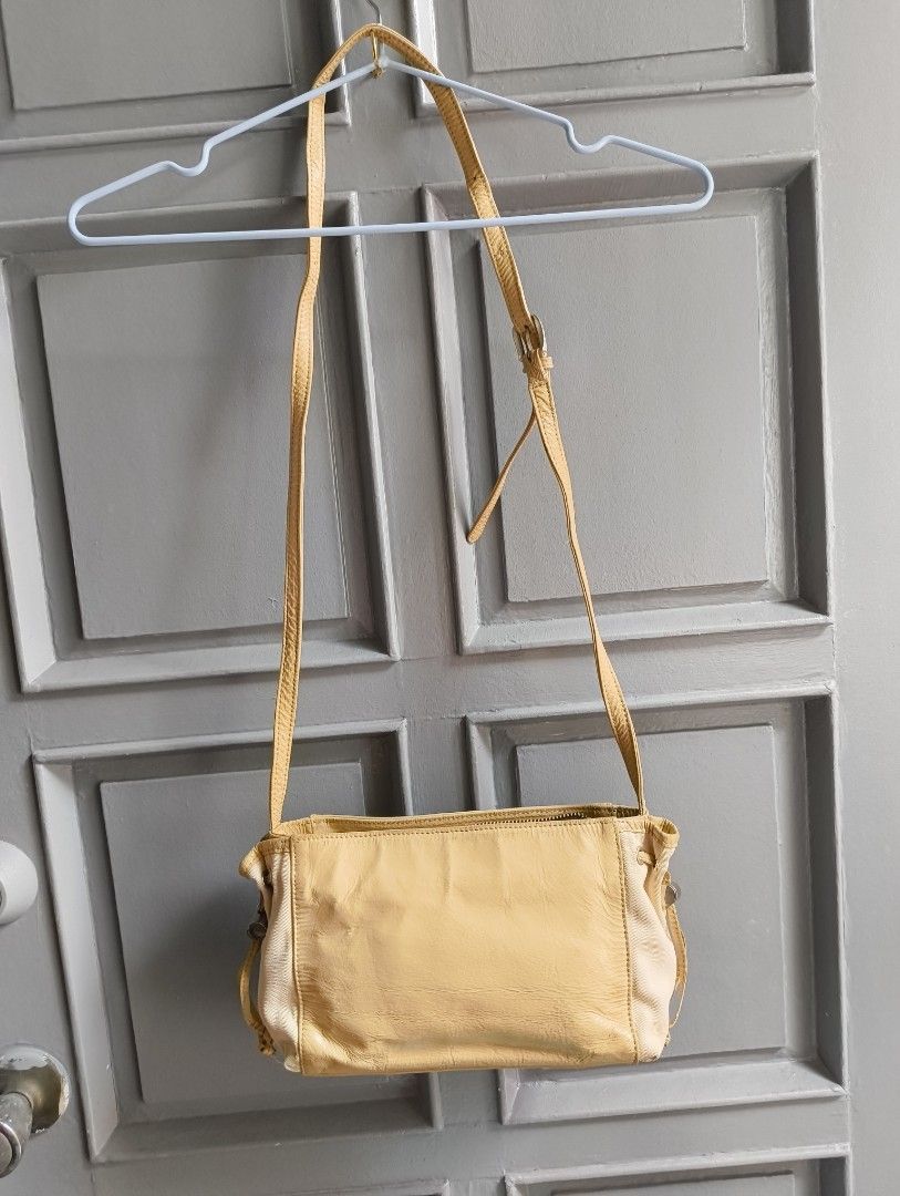 Courreges Shoulder Bag (Category: Luxury Bags & Wallets) located in Caloocan City. Submitted by makyojs (Listing ID 1420870945, Image 2). Description: - Courreges shoulder bag in beige - Zip closure - Adjustable strap - Multiple interior compartments - Rectangular shape - Light beige color with contrasting beige side panel - Courreges logo on front and inside.