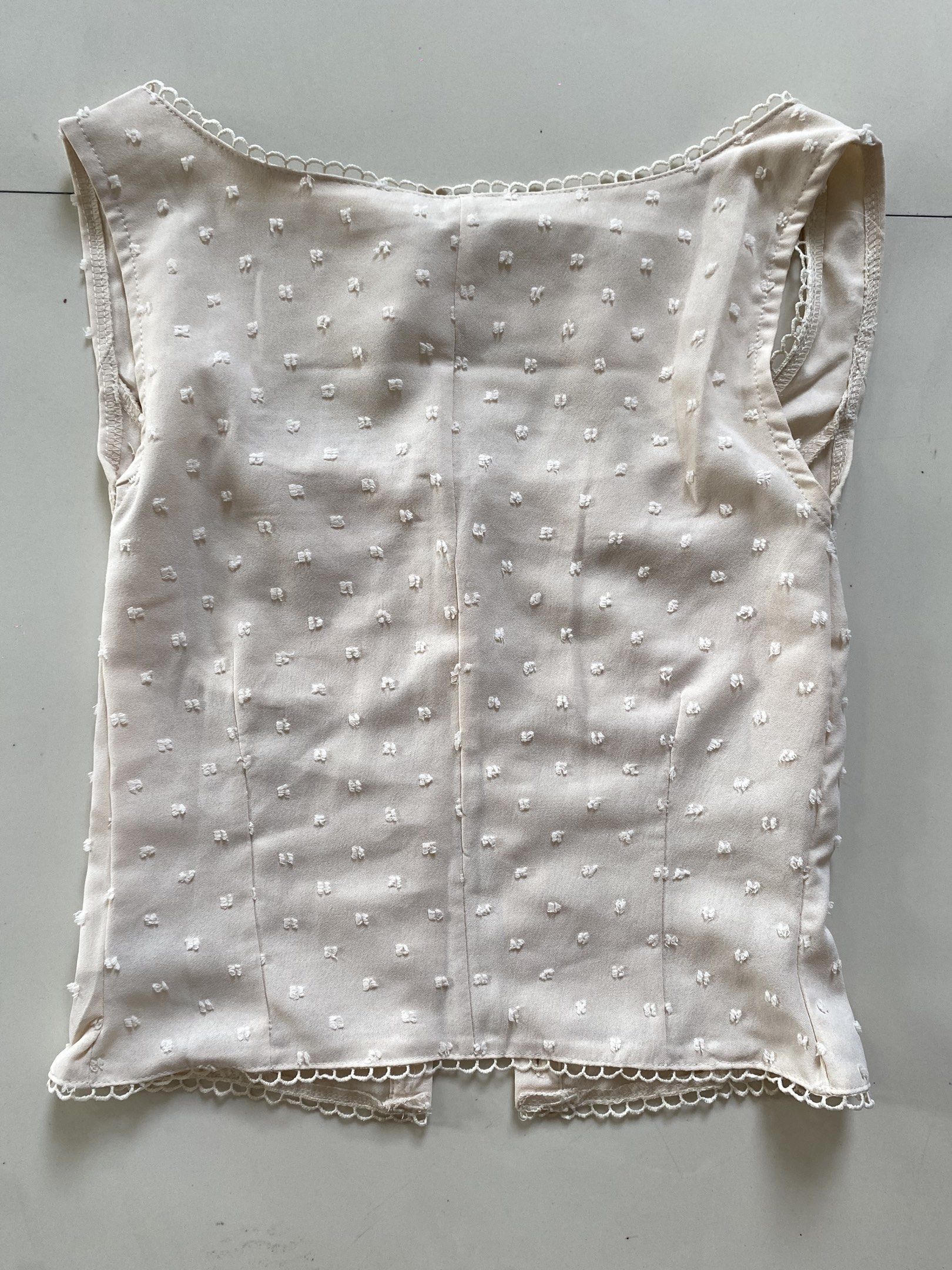 Cream Button-Up Sleeveless Top (Category: Sleeveless) located in Valenzuela. Submitted by mikaaaami (Listing ID 1420795961, Image 3). Description: ☆ Super cute and very coquette!!!! ☆ Used only once ☆ Size S but fits XS-M ☆ No flaws.