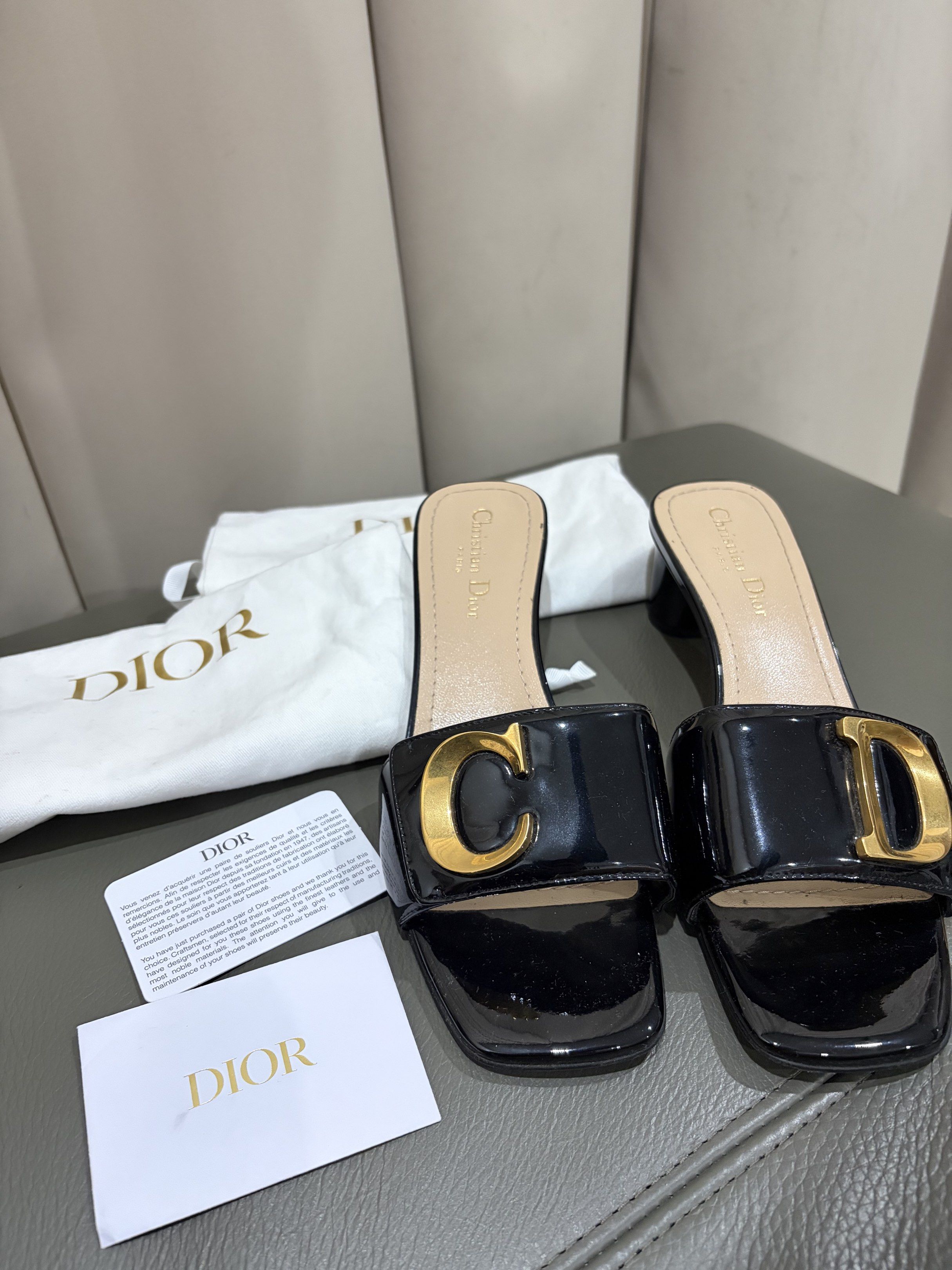 Dior Black Patent Leather Sandals (Category: Sneakers & Footwear) located in Marikina City. Submitted by authenticbrandsforless (Listing ID 1420883112, Image 2). Description: Christian Dior C’est Dior 50mm slide sandals in black patent leather with gold-tone “CD” logo accents Inclusions: Original dust bags per shoes Dior card In very good condition Rfs: not using it anymore.