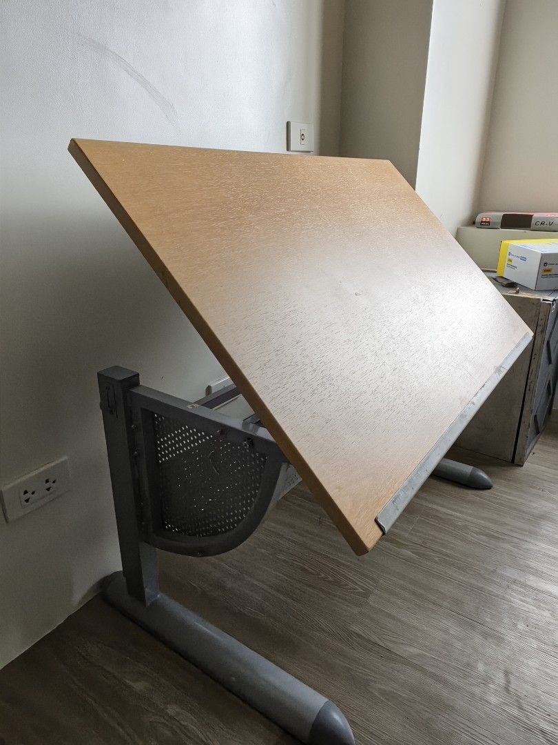 Drafting Table (Category: Tables & Sets) located in Pasig City. Submitted by yg.ent (Listing ID 1420863530, Image 1). Description: 📍 original price: 8k 📍 adjustable height, standard size 📍freebies: triangle ruler set and templates (worth 1k) 📍 last price posted 📍 rfs: no need na for school please do message me for more info. 📲.
