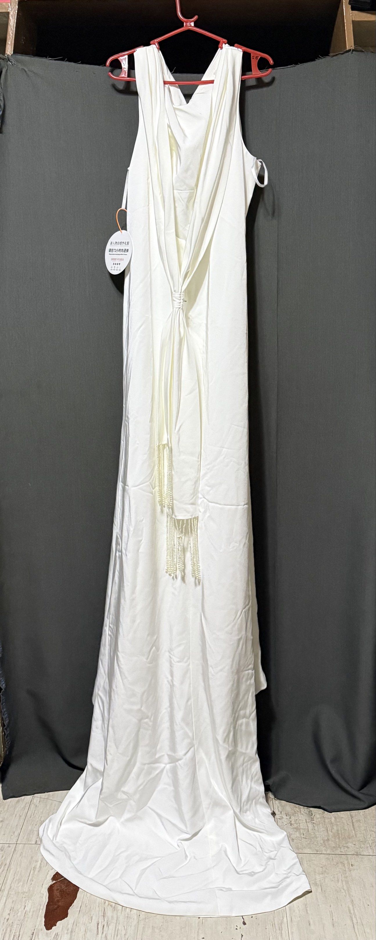 Elegant White Wedding Dress (Category: Evening dresses & gowns) located in Makati City. Submitted by _sshobe (Listing ID 1420765336, Image 3). Description: XXXL 38 inches bust 31 inches waist - Stunning white wedding dress - Draped cowl neckline - Flowing silhouette - Low back design - Delicate tie detail - Beaded accents - Subtle train - Ideal for weddings and special occasions.