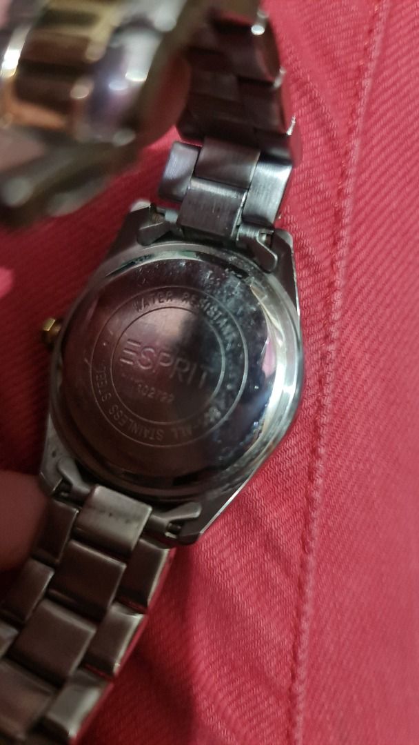 Esprit Stainless Steel Watch (Category: Women's Watches) located in Antipolo. Submitted by francesca2005 (Listing ID 1420835386, Image 3). Description: Esprit watch features a stainless steel band with gold accents. The watch face has a gold-colored bezel and a white dial. The back of the watch indicates it is water-resistant. The clasp is a fold-over style..