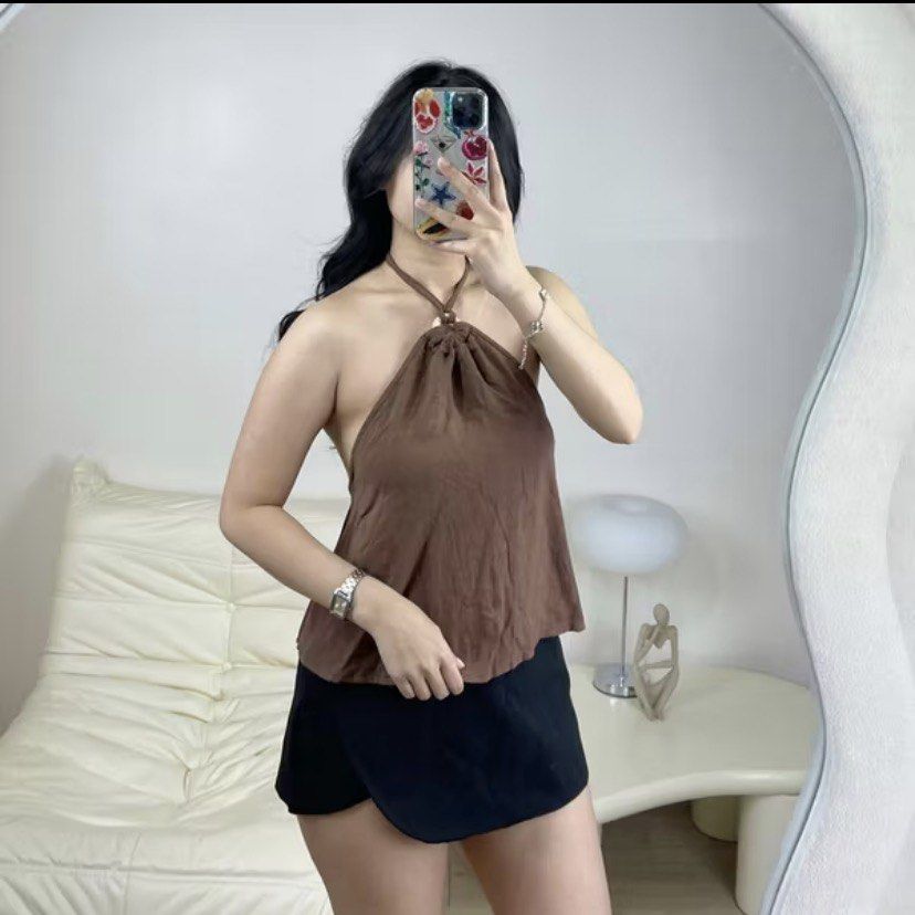 Essentiel Manila linen top (Category: Sleeveless) located in Quezon City. Submitted by patrishx (Listing ID 1420766469, Image 1). Description: - Brown halter top - Halter neck with drawstring - Relaxed fit - Great for casual or night out.