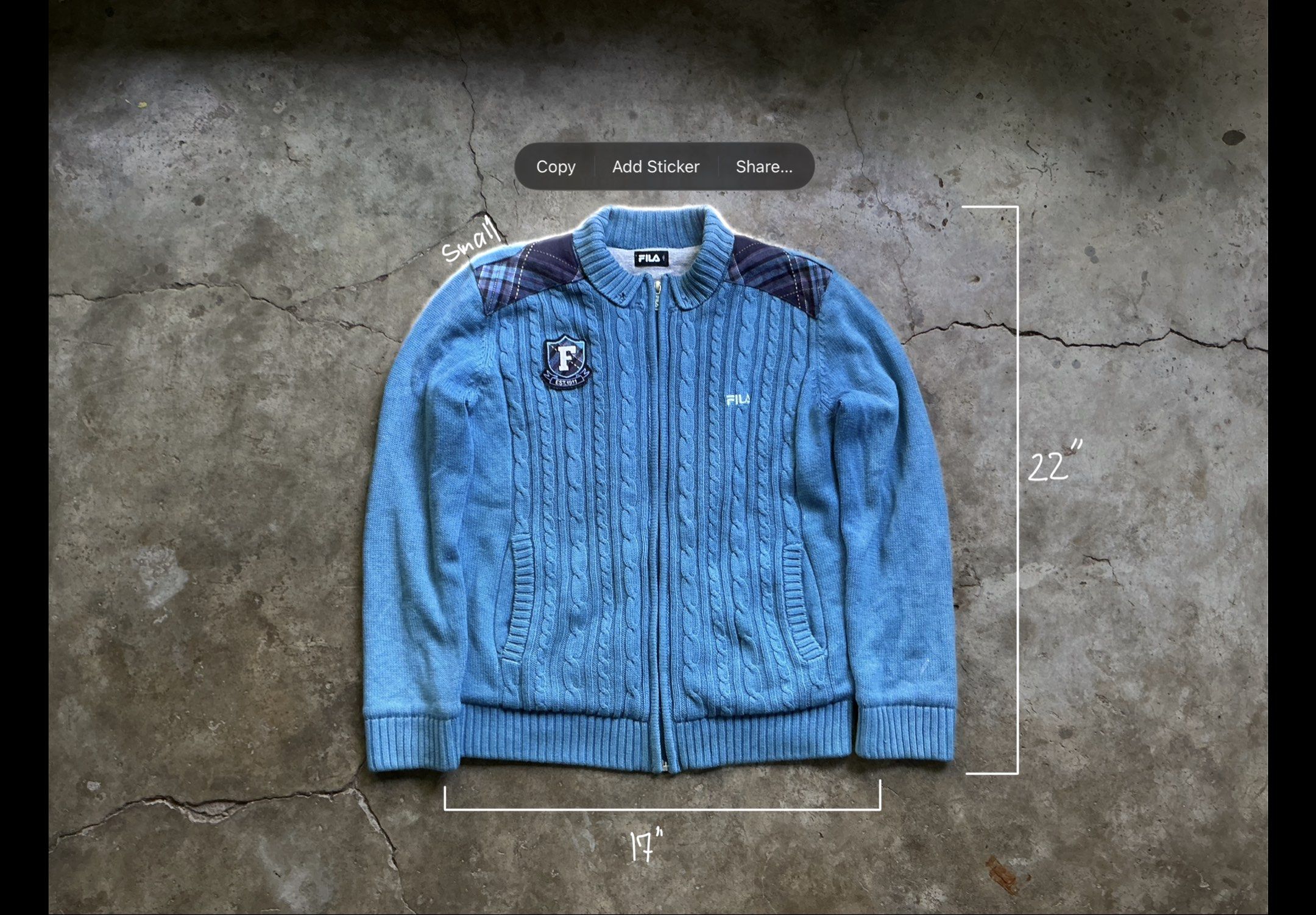 Fila Blue Cable Knit Jacket and Brown Pants Set (Category: Coats, Jackets and Outerwear) located in San Pablo. Submitted by rushnthrift (Listing ID 1420909872, Image 2). Description: - Fila jacket and pants set - Jacket Details: - Blue cable knit design - Zipper closure - Star pendant - Fila logo - Plaid shoulder detail - Small "F" patch - Jacket Measurements: 17" chest, 22" length - Stylish and ready to wear!.