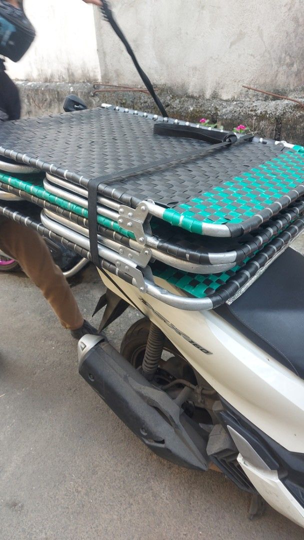 Folding Bed with Woven Surface (Category: Bed Frames & Mattresses) located in Quezon City. Submitted by michaelangelomendoza0209 (Listing ID 1420933593, Image 1). Description: Refurbished 980 plus lalamove delivery - Folding bed with woven black surface - Sturdy metal frame - Folds for easy storage and transport - Compact design - Perfect for guests or outdoor use.