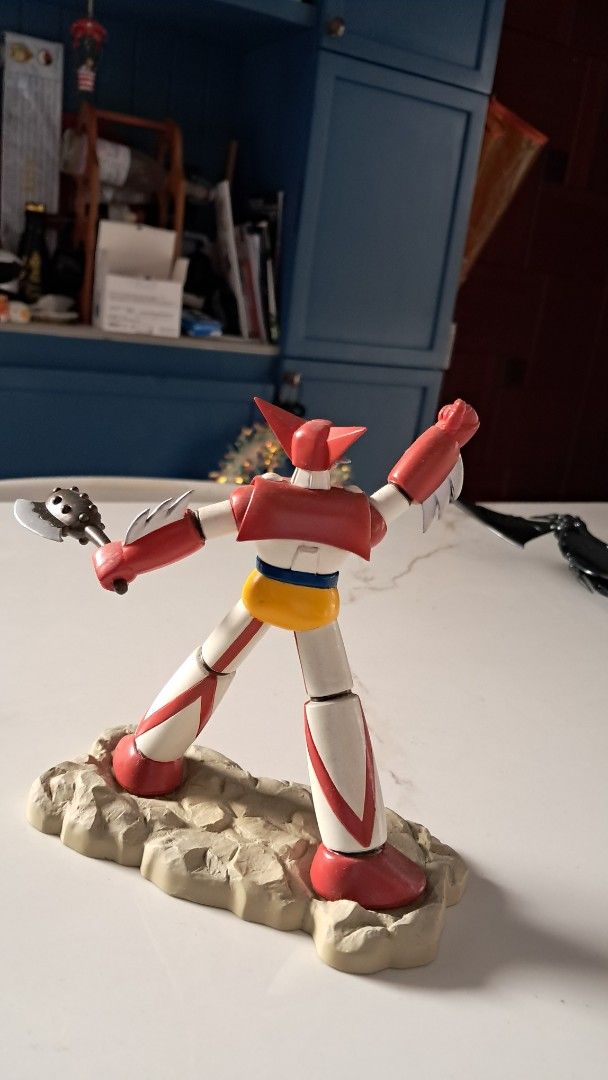 Getter Robo G Getter 1 Action Figure (Category: Figurines & Statues) located in Santa Rosa. Submitted by majanice (Listing ID 1420765775, Image 2). Description: - Getter Robo G Getter 1 action figure - Eye-catching red, white, yellow, and green color scheme - Includes a detailed rocky base - Comes with a weapon accessory - Features articulated joints for posing - Highly collectible item.