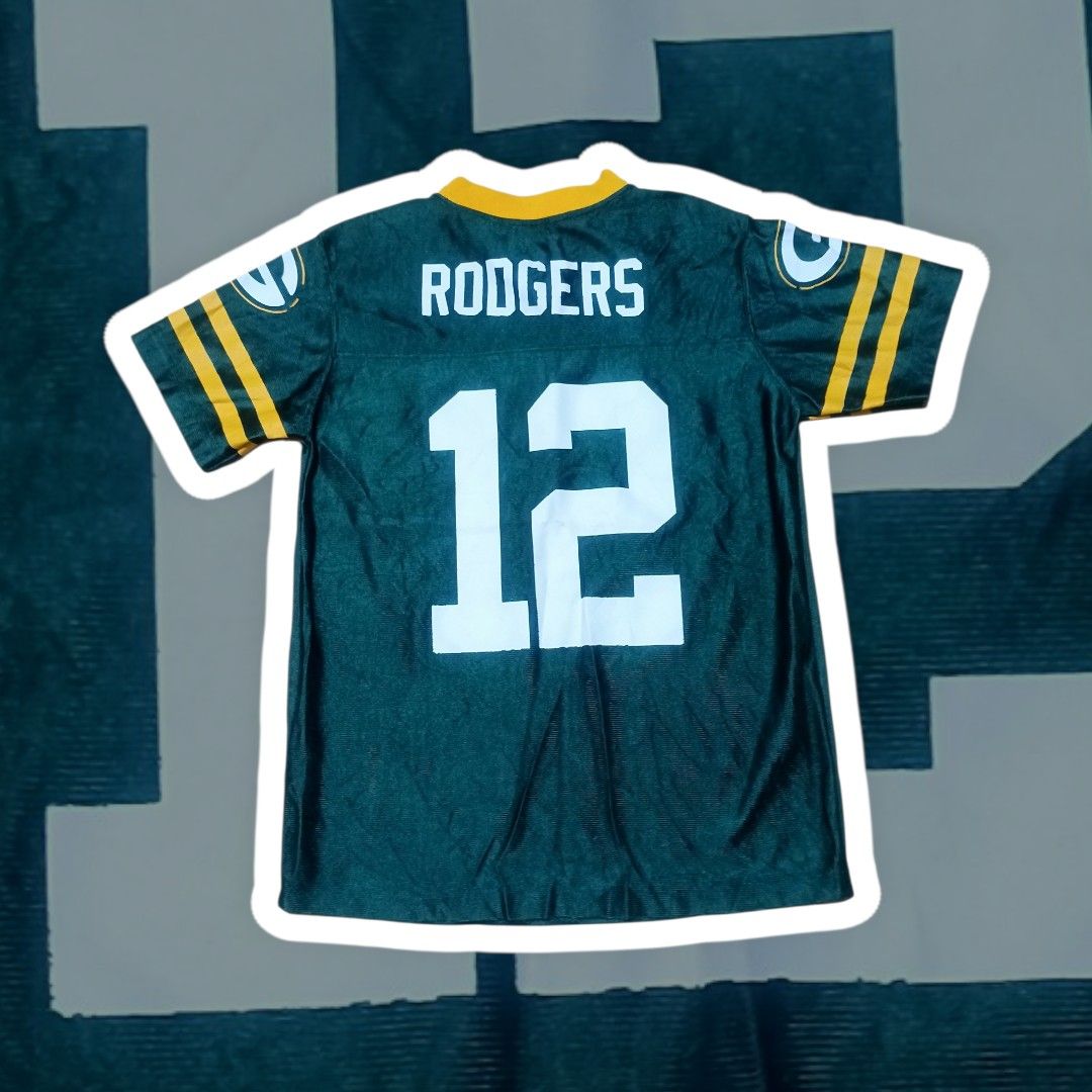 GREEN BAY PACKERS RODGERS JERSEY #12 (Category: Activewear) located in Calamba. Submitted by lostandfoundoutfitters (Listing ID 1420900841, Image 2). Description: GREEN BAY PACKERS "RODGERS" NFL JERSEY #12 Dimes: 17.5 x 23 Condition: 9/10 No Issue: Need Wash Only! Authentic 💯 Collectible 💯 Hand Picked •ITEMS ARE FROM THRIFT SHOP SO LIMIT YOUR EXPECTATIONS. •WASH THE CLOTHES BEFORE WEARING. •BUY AT YOUR OWN RISK. • COLOR MAY VARY DUE TO LIGHTING