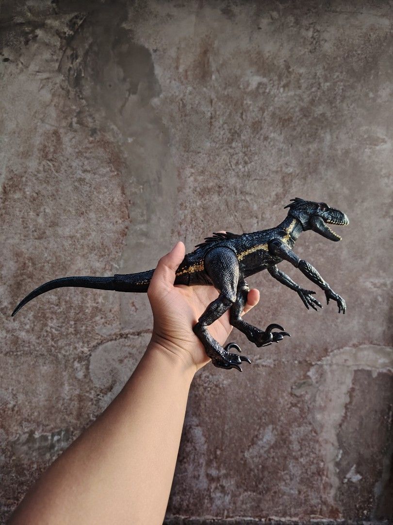 Jurassic World Indoraptor Action Figure (Category: Figurines & Statues) located in Baguio. Submitted by lukewarmwaterboy (Listing ID 1420828596, Image 1). Description: - Jurassic World Indoraptor action figure - Detailed design - Articulated limbs - Black and gold color scheme - Textured skin and sharp claws - Collectible item.