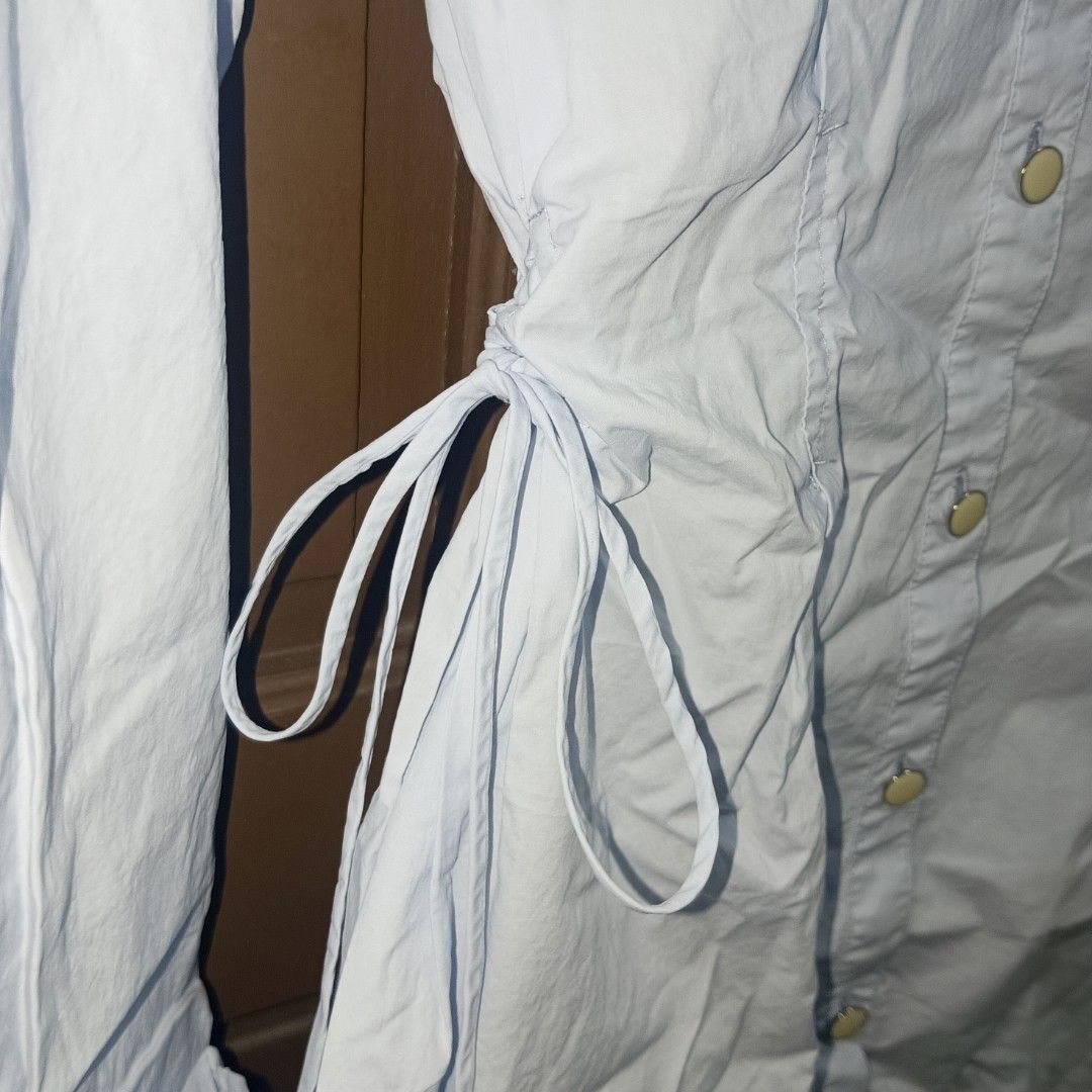 Light Blue Polo Dress with Side Ruch (Category: Tshirts & Polo Shirts ) located in Caloocan City. Submitted by yoon_ara (Listing ID 1420856790, Image 3). Description: ONLY light blue shirt. Collared neckline, long sleeves, and button-down closure. Features ruch ties on the sides. Lightweight fabric. .