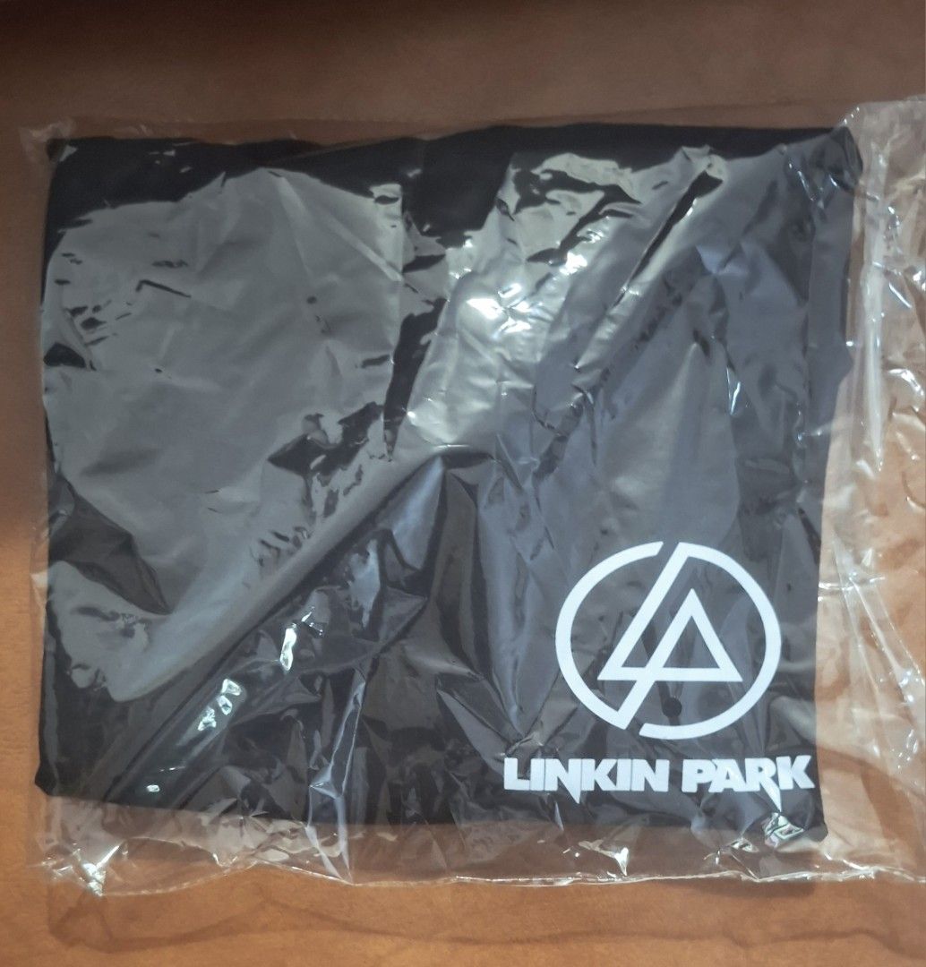 Linkin Park Black T-shirt (Category: Tshirts & Polo Shirts ) located in Imus. Submitted by ages_printing (Listing ID 1420794794, Image 2). Description: - Brand new Linkin Park t-shirt - Black color - Features the band's logo and symbol in white - Crew neck style - Unworn and in original packaging.