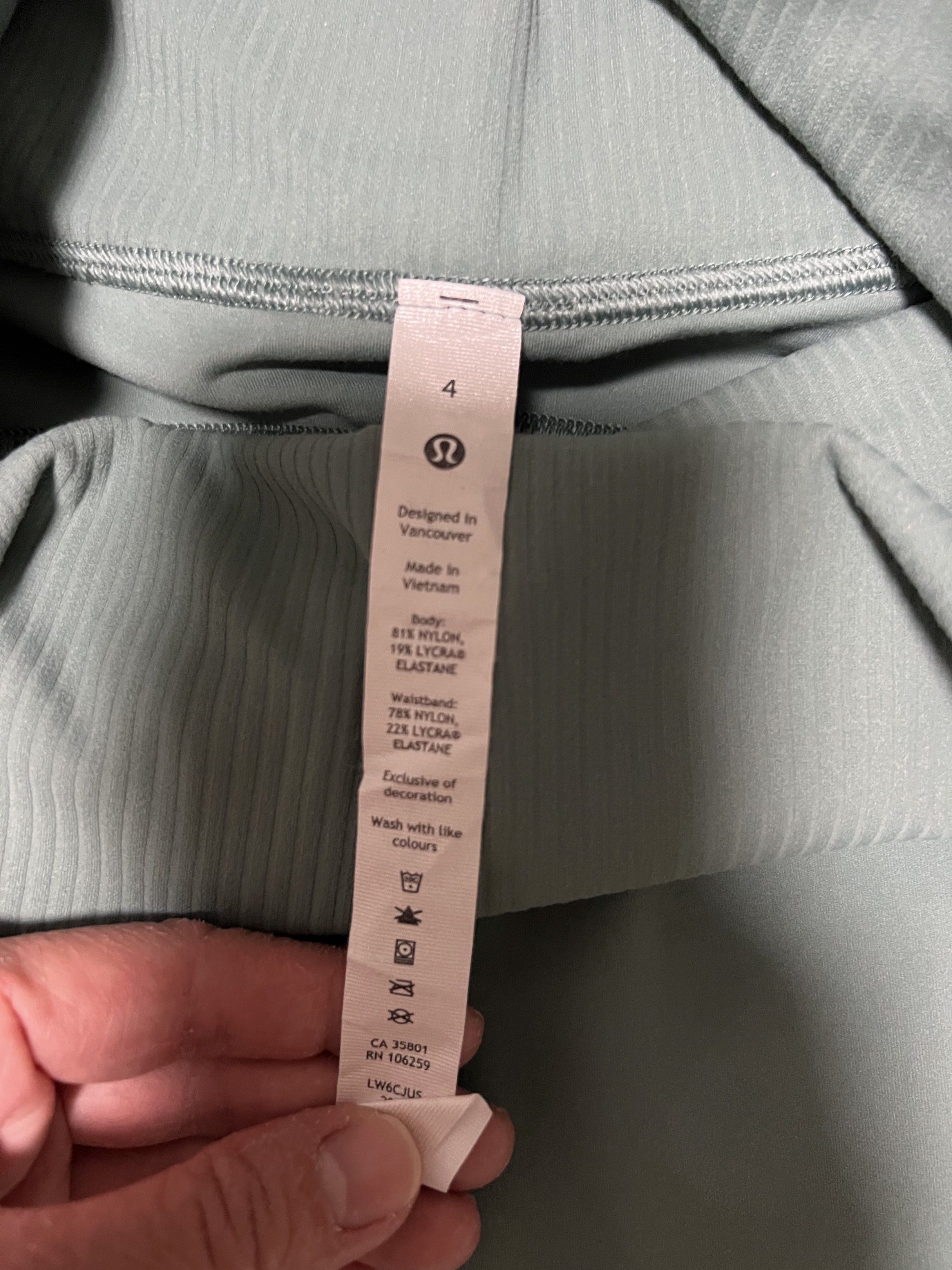 Lululemon work out / running leggings (Category: Activewear) located in Angeles City. Submitted by chiccharm (Listing ID 1420932907, Image 2). Description: - Lululemon Align High-Rise Crop 23" pants - Light green color - Size 4 - Ribbed waistband - Material: 81% nylon, 19% lycra elastane (body); 78% nylon, 22% lycra elastane (waistband) - Features the Lululemon logo.