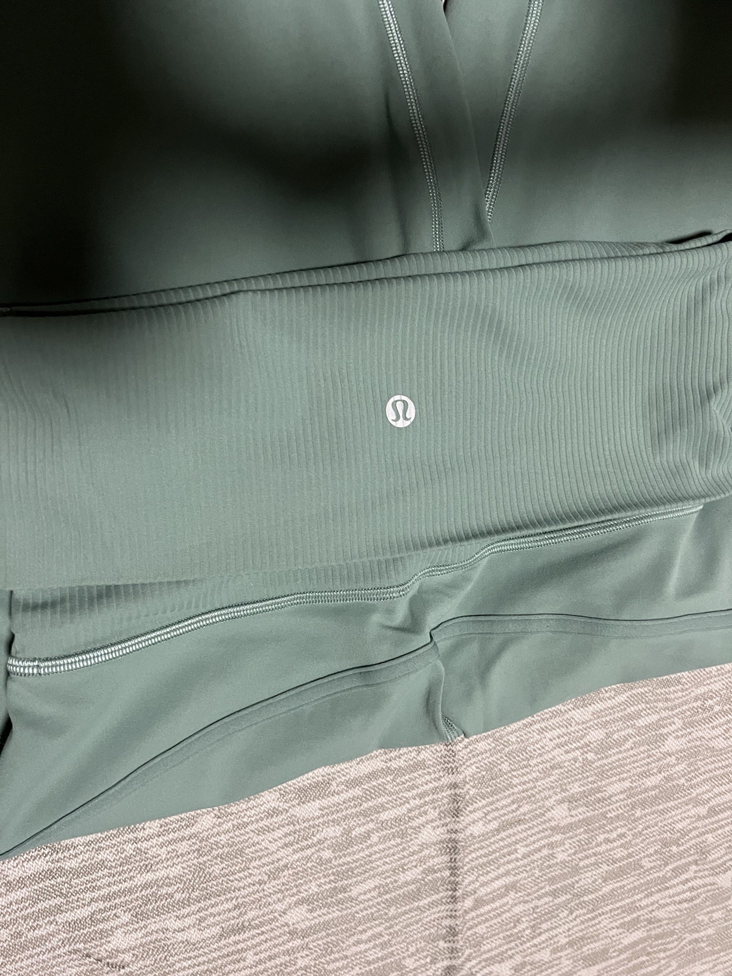 Lululemon work out / running leggings (Category: Activewear) located in Angeles City. Submitted by chiccharm (Listing ID 1420932907, Image 3). Description: - Lululemon Align High-Rise Crop 23" pants - Light green color - Size 4 - Ribbed waistband - Material: 81% nylon, 19% lycra elastane (body); 78% nylon, 22% lycra elastane (waistband) - Features the Lululemon logo.