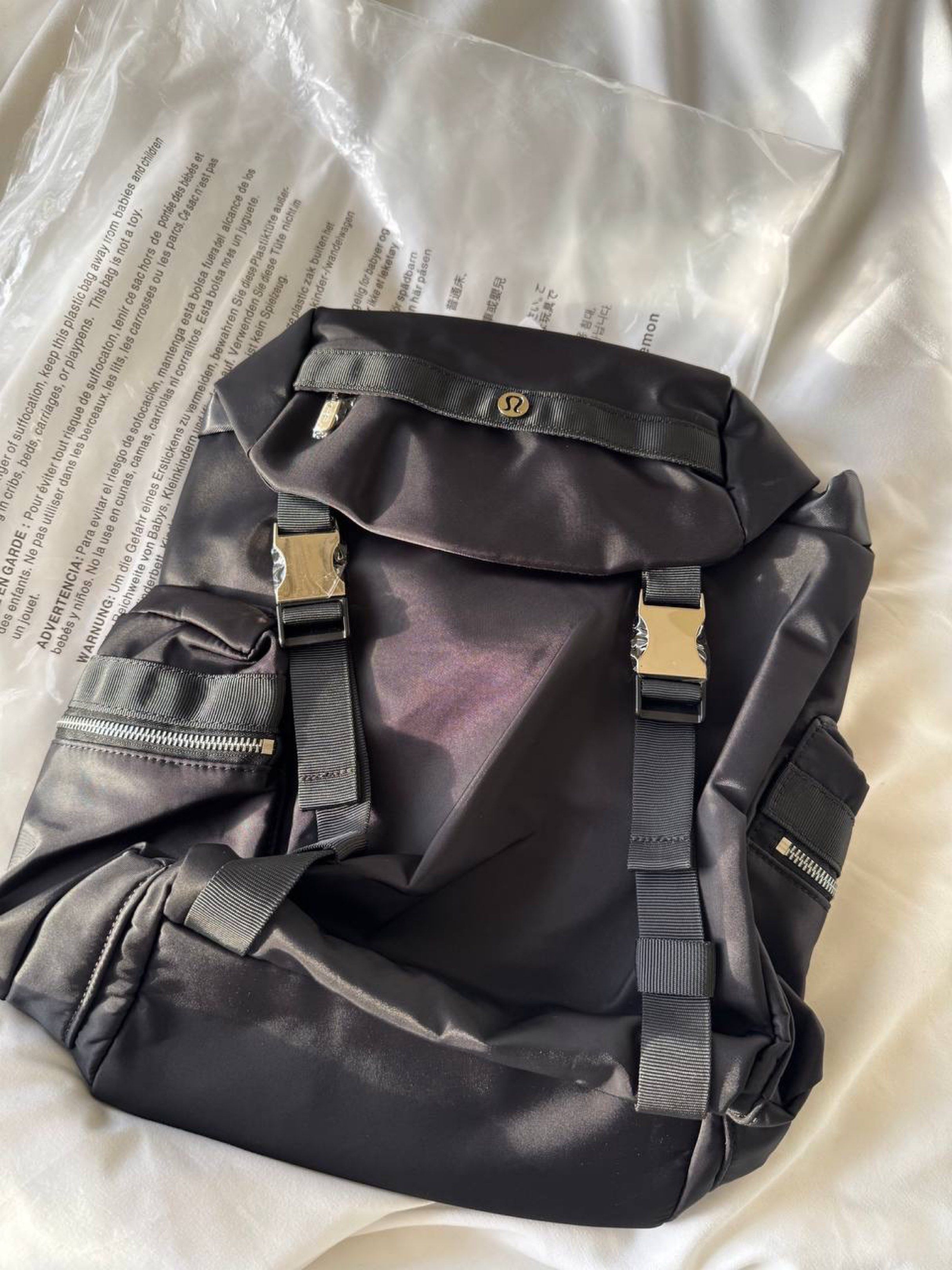 Lululemon Wunderlust Backpack 14L (Category: Backpacks) located in Muntinlupa City. Submitted by thebeautymakeup (Listing ID 1420779321, Image 2). Description: - Lululemon Wunderlust Backpack 14L - Features multiple zippered pockets, adjustable straps, and a top flap with buckle closures. - Includes the Lululemon logo on the front. - The backpack has a sleek, minimalist design. - Available in black, khaki, army green - Original Price in website $