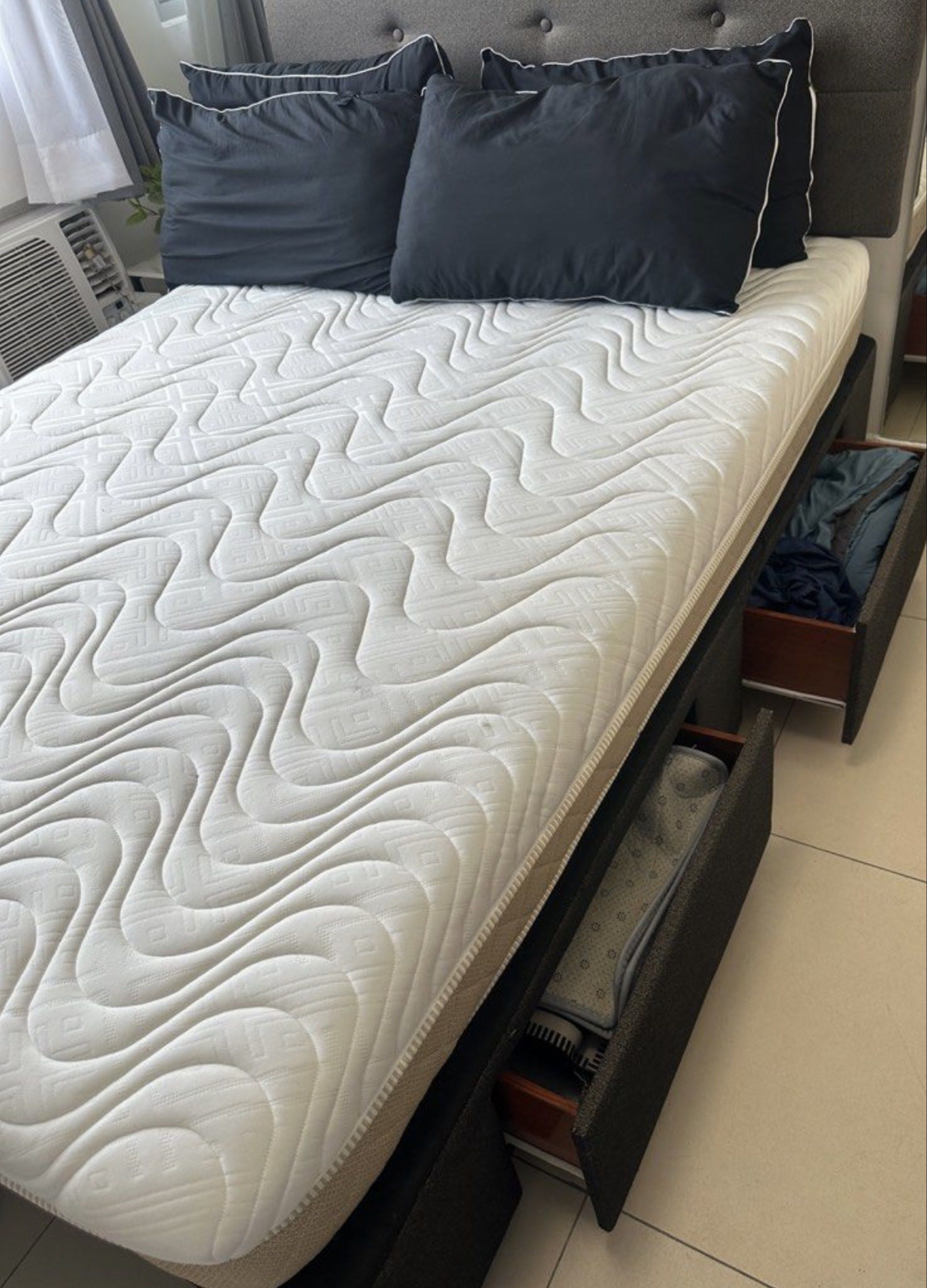 Mattress for sale (Category: Bed Frames & Mattresses) located in Quezon City. Submitted by pjrosetase (Listing ID 1363585160, Image 3). Description: Double-Size Bed with Frame and Mattress Description: - Double-size bed with sturdy frame and padded headboard - high quality 8-inch mattress - Wooden bed base with drawers for storage Condition: - Gently used for only 4 months by tenants - Purchased in June 2024, relatively new and well-maintained co