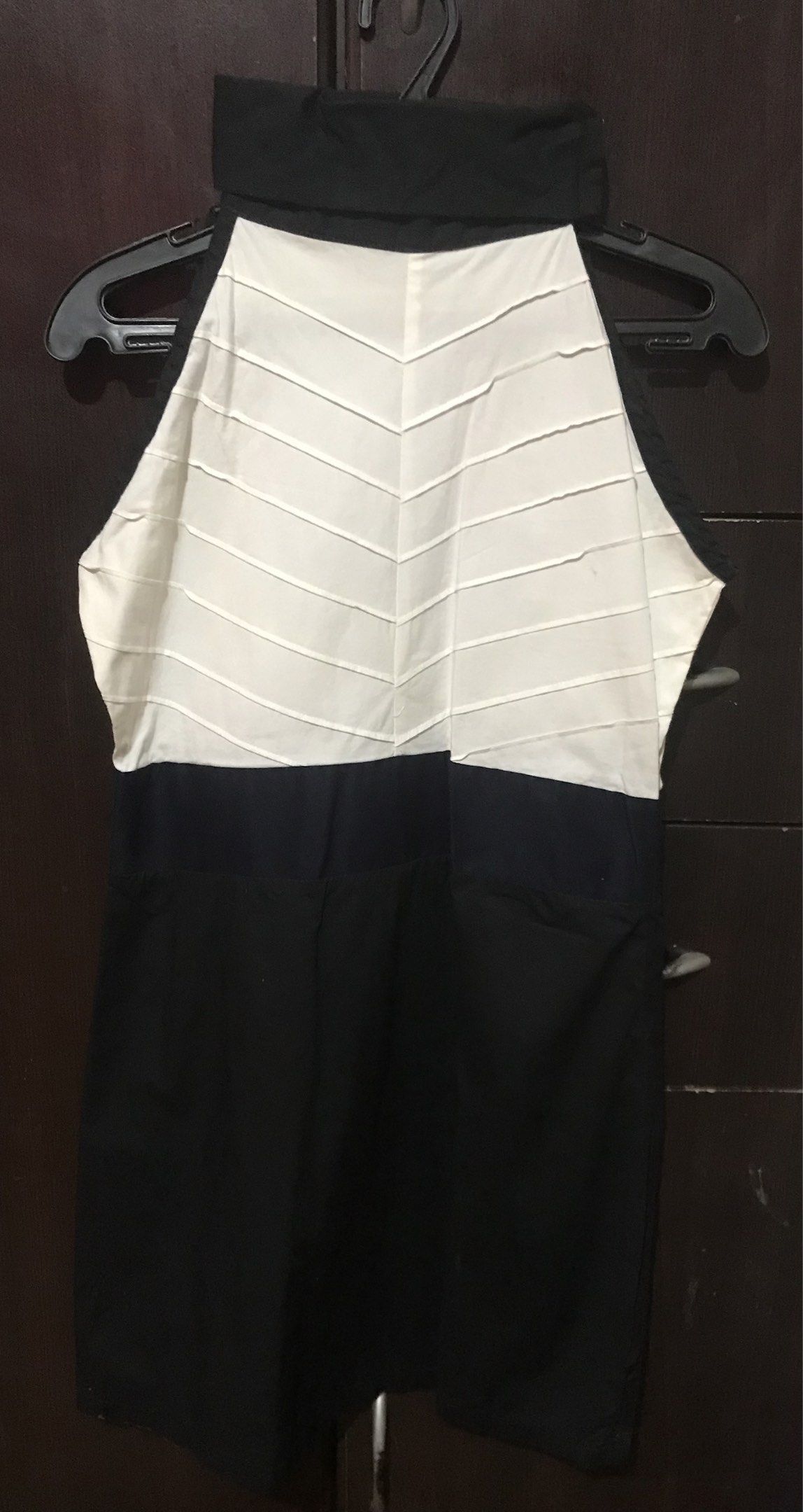 Meg Black and White Dress (Category: Dresses) located in Rizal. Submitted by Houseoftiki (Listing ID 1420845235, Image 1). Description: - Unique black and white color scheme - White top with horizontal lines - Black bottom - Elegant halter neck design - Made of smooth fabric - Versatile dress for various events.