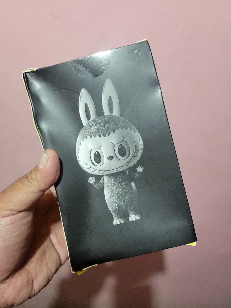 Mega Labubu The Monsters Sketch (Category: Designer & Blind Box Toys) located in Manila. Submitted by jay_zone13 (Listing ID 1420838810, Image 3). Description: - Mega Labubu figure from The Monsters Sketch series. - Brand new, unopened in original packaging. - Packaging features a unique yellow and black design. - Clear window allows for figure viewing. - Includes brand name and series information on the box..