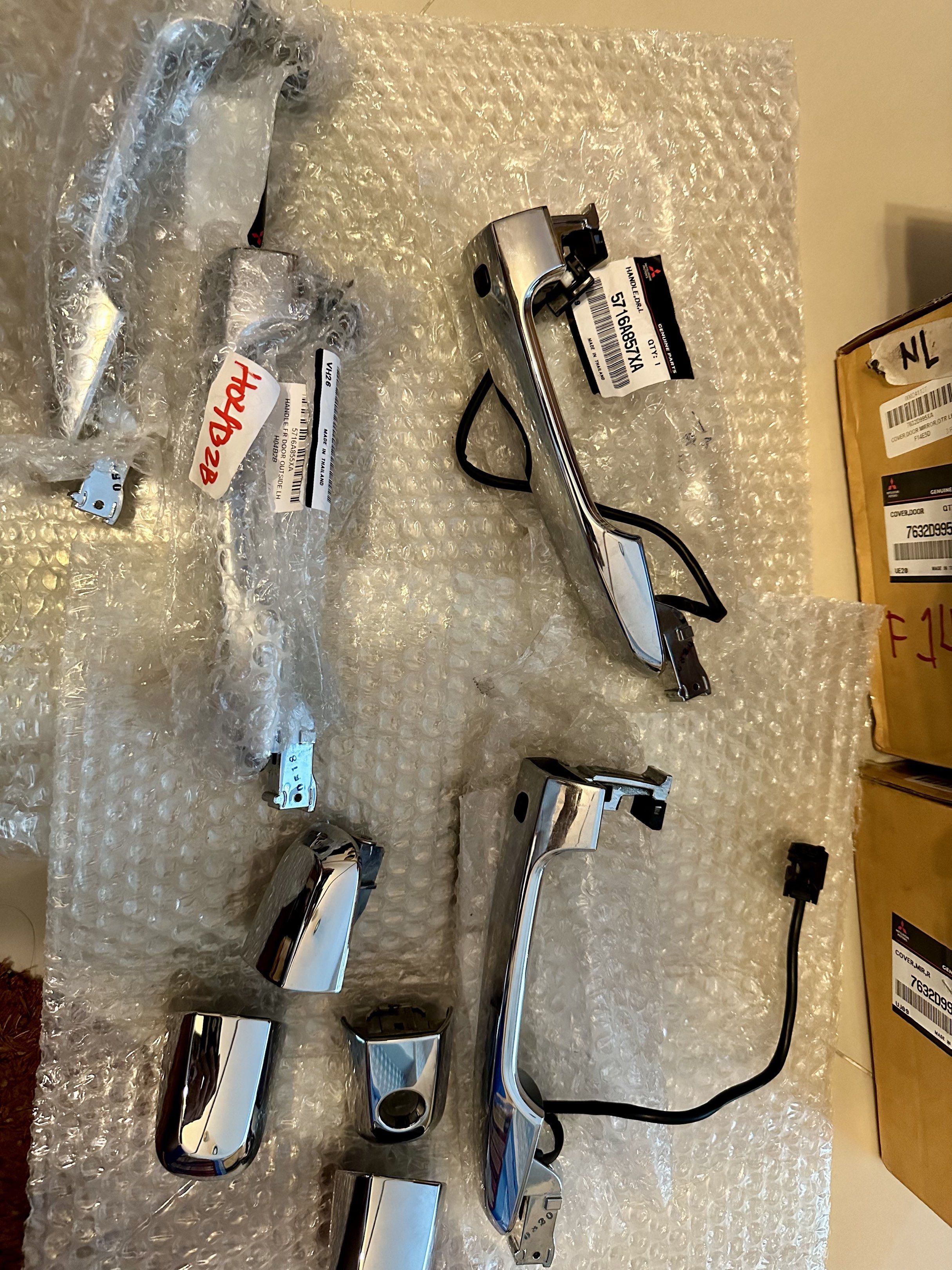 Mitsubishi Chrome Door Handles (Category: Other Automotive Parts and Accessories) located in Manila. Submitted by vino824 (Listing ID 1420770332, Image 2). Description: Parts out: GENUINE Mitsubishi Strada/Triton GLS 2020 model door handles - Genuine Mitsubishi car parts - Includes chrome door mirror covers - Includes door handles with wiring - Parts are in original packaging Door Handles: 5716A857XA (4pcs) Used for 5 years, no damages, hairline 