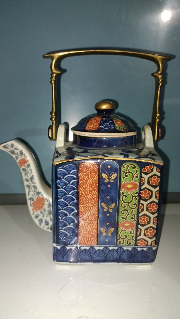 Miyako Imari Ware Tea pot with Brass Handle (Category: Dinnerware & Cutlery) located in Munoz. Submitted by larryc1212 (Listing ID 1420895571, Image 3). Description: - Miyako Imari Ware teapot. - Features a brass handle. - Showcases a detailed and colorful design. - Ideal for display or tea service. - Perfect for Collectors Item may include some scratches due to age, as is were is basis Item can be pick up in our Japan surplus shop located in Mun