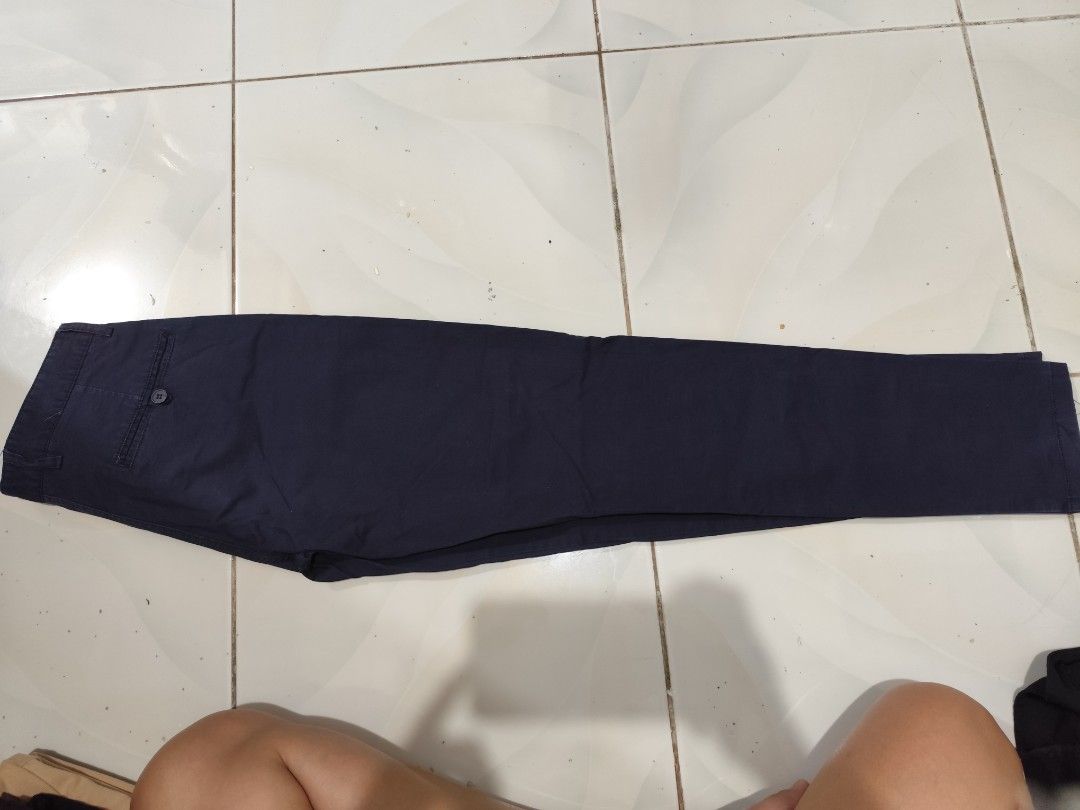 Navy Blue Pants (Category: Other Bottoms) located in Quezon City. Submitted by melsc (Listing ID 1420931547, Image 1). Description: SIZE:27 USED ONCE FOR SCHOOL PROGRAM - Navy blue pants - Classic design - Comfortable fit - Button closure - Pockets - Durable fabric - Easy to care for - Suitable for casual and semi-formal occasions.