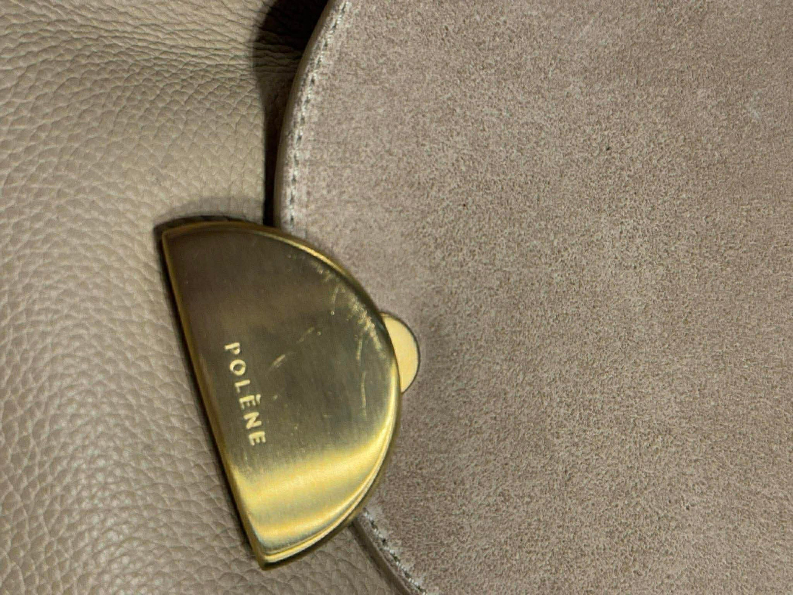 Polène Numéro Sept Bag (Category: Luxury Bags & Wallets) located in Batangas. Submitted by mjdel (Listing ID 1420835490, Image 3). Description: - Polène Numéro Sept bag - Neutral beige color - Stylish flap closure with gold-tone clasp - Luxurious suede top flap - Elegant chain strap - Textured leather exterior - Spacious interior - Convenient back pocket.