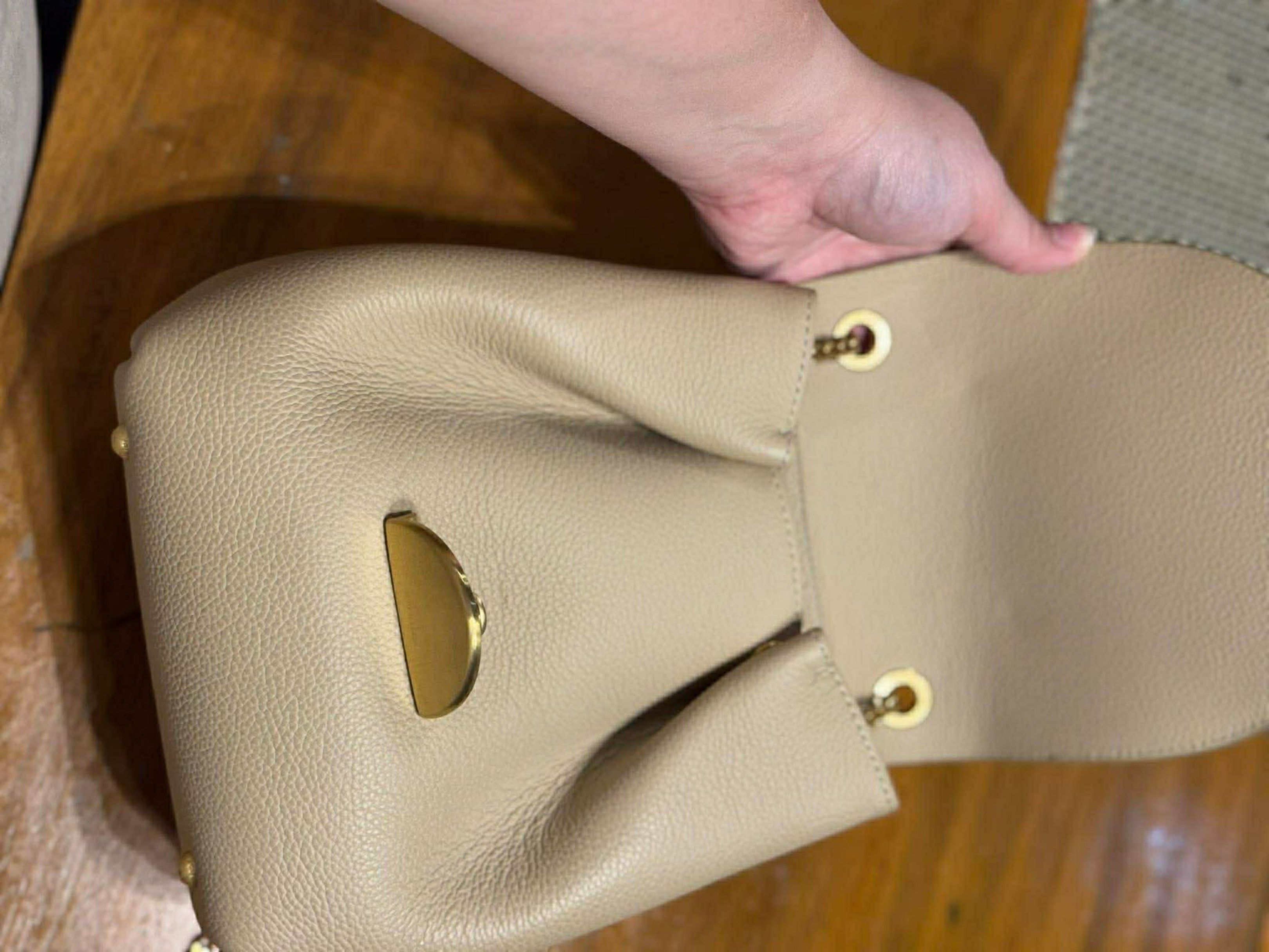 Polène Numéro Sept Bag (Category: Luxury Bags & Wallets) located in Batangas. Submitted by mjdel (Listing ID 1420835490, Image 2). Description: - Polène Numéro Sept bag - Neutral beige color - Stylish flap closure with gold-tone clasp - Luxurious suede top flap - Elegant chain strap - Textured leather exterior - Spacious interior - Convenient back pocket.