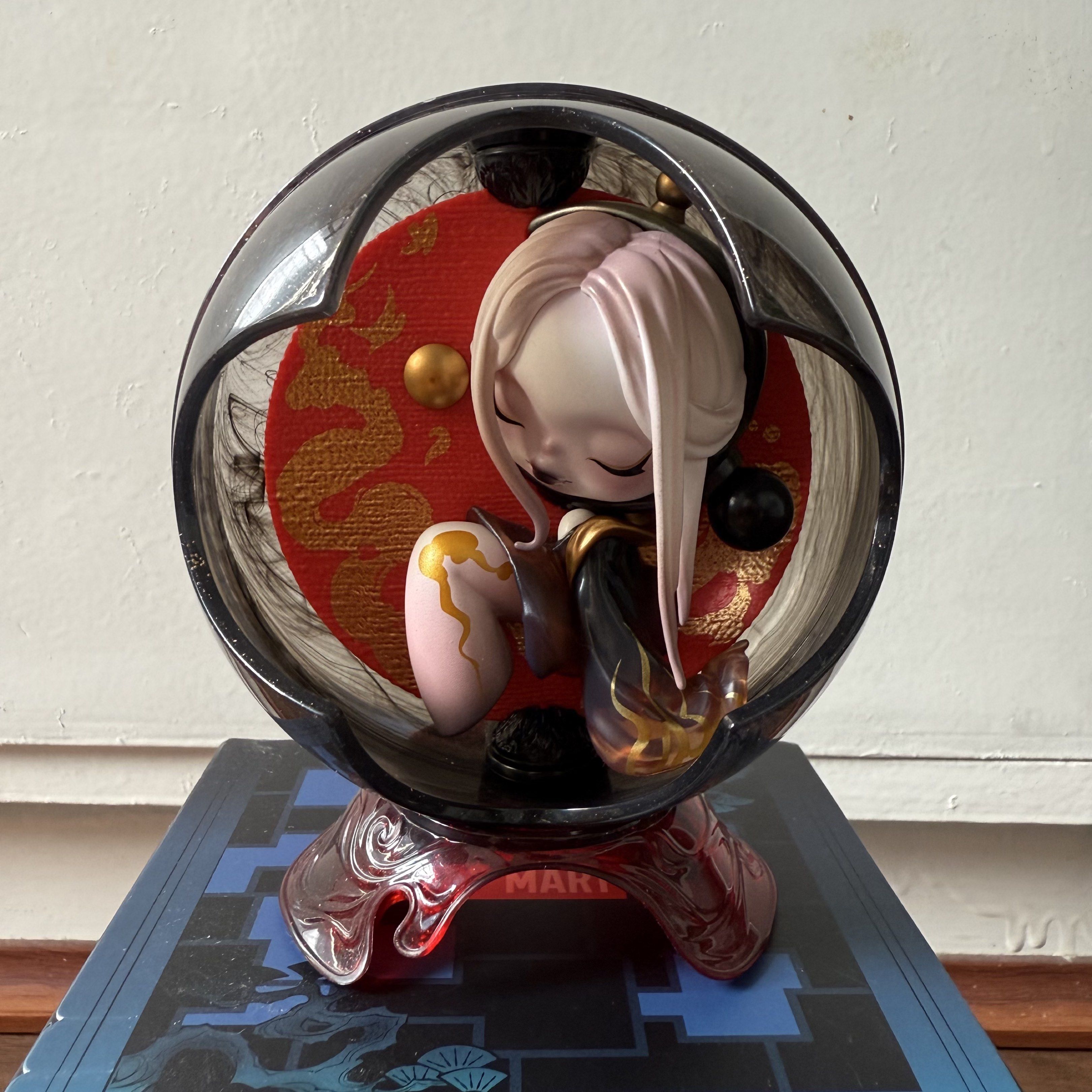 POP MART Skullpanda The Mirage Figure (Category: Designer & Blind Box Toys) located in Angono. Submitted by byeonggi (Listing ID 1420749799, Image 2). Description: - Skullpanda The Mirage figure for sale. - Unique design with character in a transparent orb. - Includes original box and collectible card. - Figure base is red. - Box features a blue and white design. - Part of the Skullpanda The Mirage series. SkullPanda The Mirage Series: The Skelet