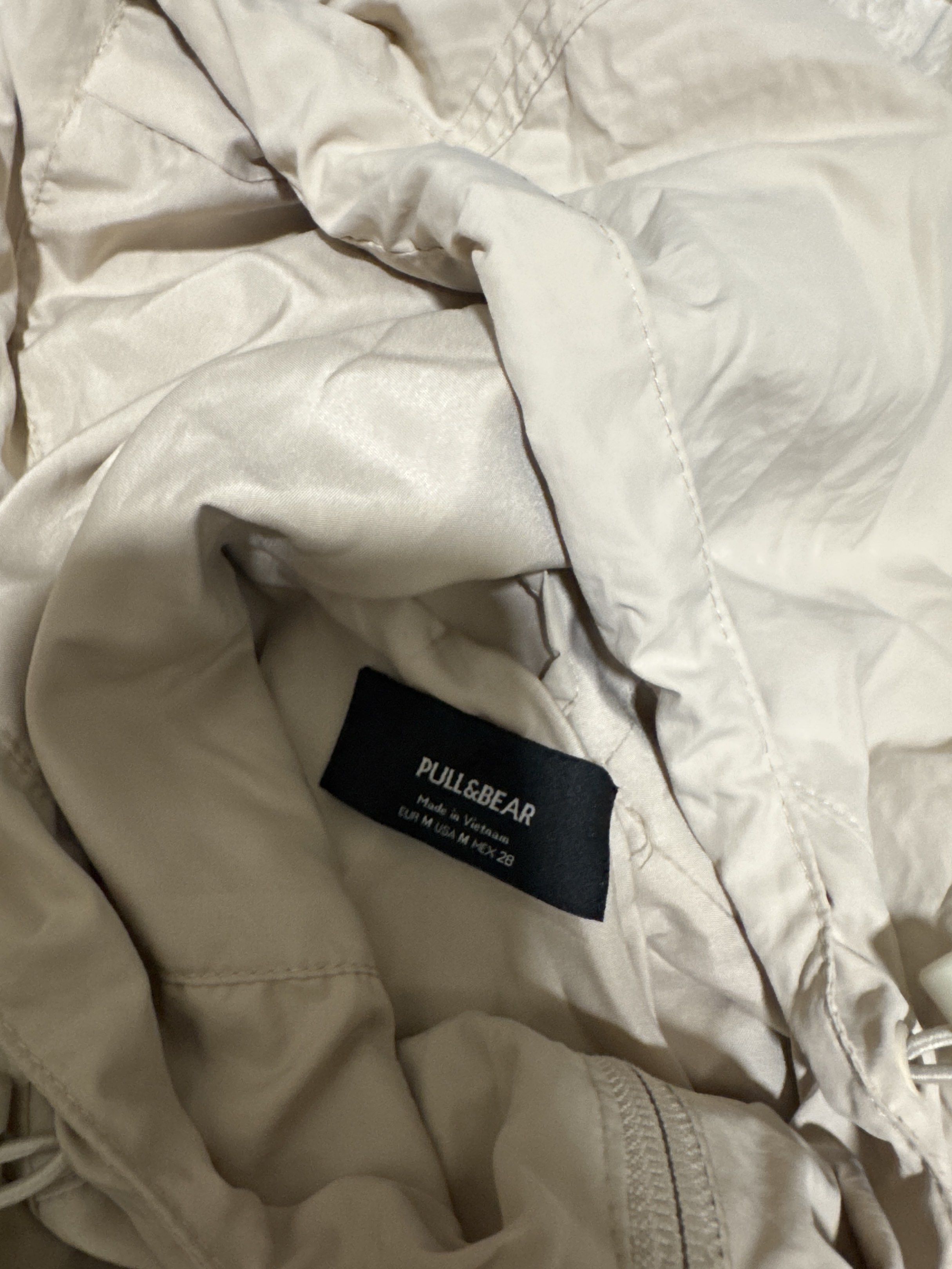 Pull & Bear Jacket (Category: Activewear) located in Singapore. Submitted by indis0ul (Listing ID 1420893755, Image 2). Description: - Pull & Bear Jacket - Size: M - Color: Neutral - Features: Hood, pockets - Condition: Light Stains - Not for fussy buyers - +$2 for normal mail.