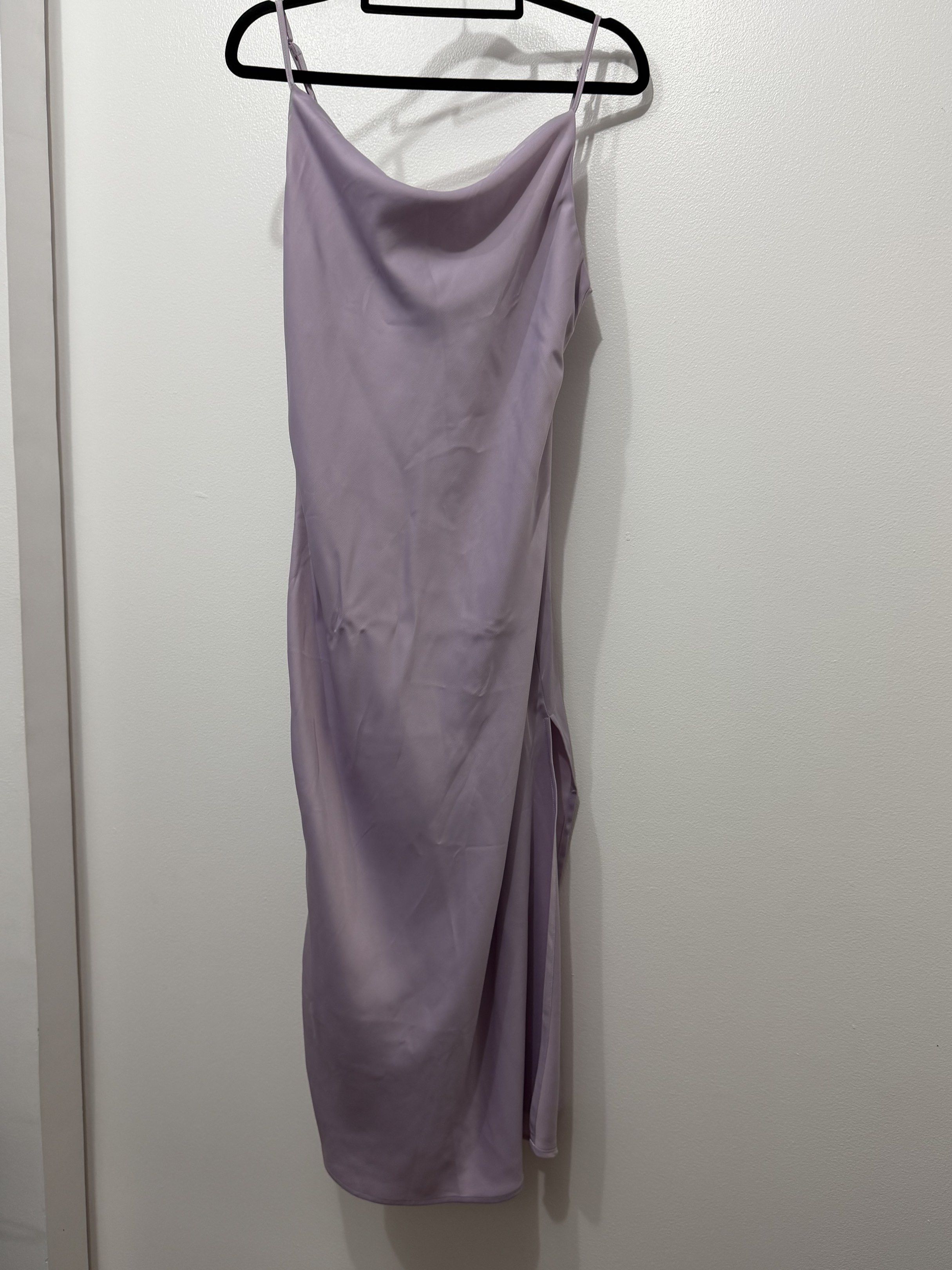 Purple Satin Dress (Category: Evening dresses & gowns) located in Manila. Submitted by beachbaaaaabe (Listing ID 1420922249, Image 1). Description: - Urban Outfitters Purple Satin Dress - Size: Small - Features a cowl neck and side slit - Made of silky satin material - Color: Purple - Condition: Good (minor imperfections, need to wash) - Meetup locations in Makati City.