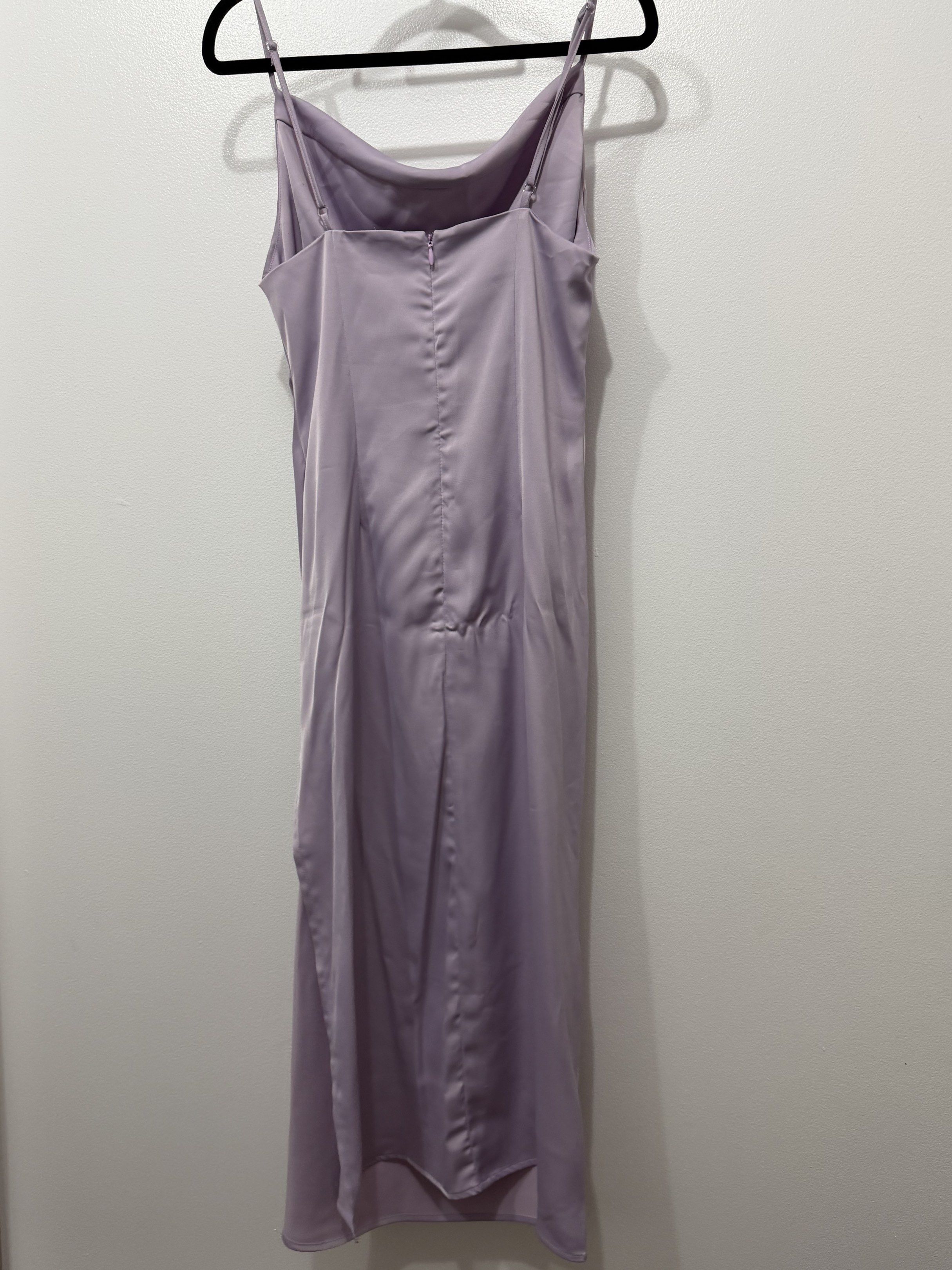 Purple Satin Dress (Category: Evening dresses & gowns) located in Manila. Submitted by beachbaaaaabe (Listing ID 1420922249, Image 2). Description: - Urban Outfitters Purple Satin Dress - Size: Small - Features a cowl neck and side slit - Made of silky satin material - Color: Purple - Condition: Good (minor imperfections, need to wash) - Meetup locations in Makati City.