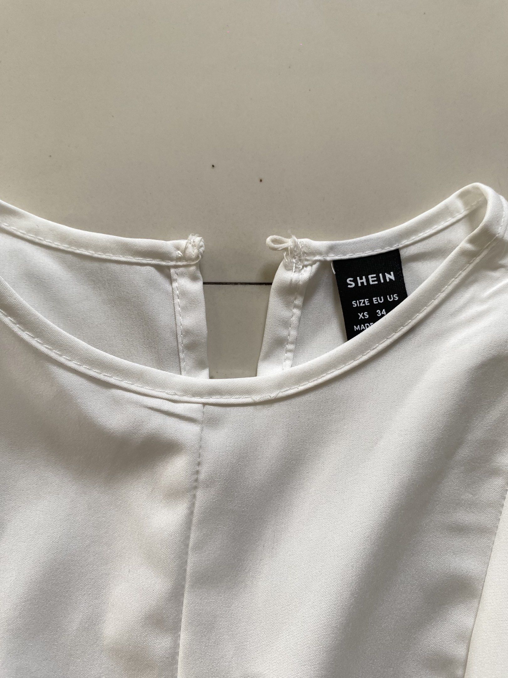 Shein White Sleeveless Top with Belt (Category: Sleeveless) located in Valenzuela. Submitted by mikaaaami (Listing ID 1420795200, Image 3). Description: ☆ Fits XS-M ☆ Good for office attire ☆ Used only once!.