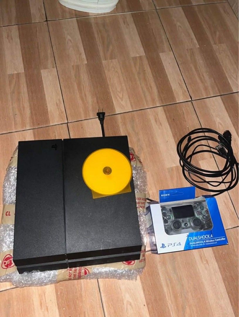 Sony PlayStation 4 Console with Controller (Category: PlayStation) located in Cuartero. Submitted by geobarredo (Listing ID 1420750096, Image 1). Description: - PlayStation 4 console - DualShock 4 wireless controller (in original packaging) - Includes power cable and game disc - Console shown powered on, ready to play!.