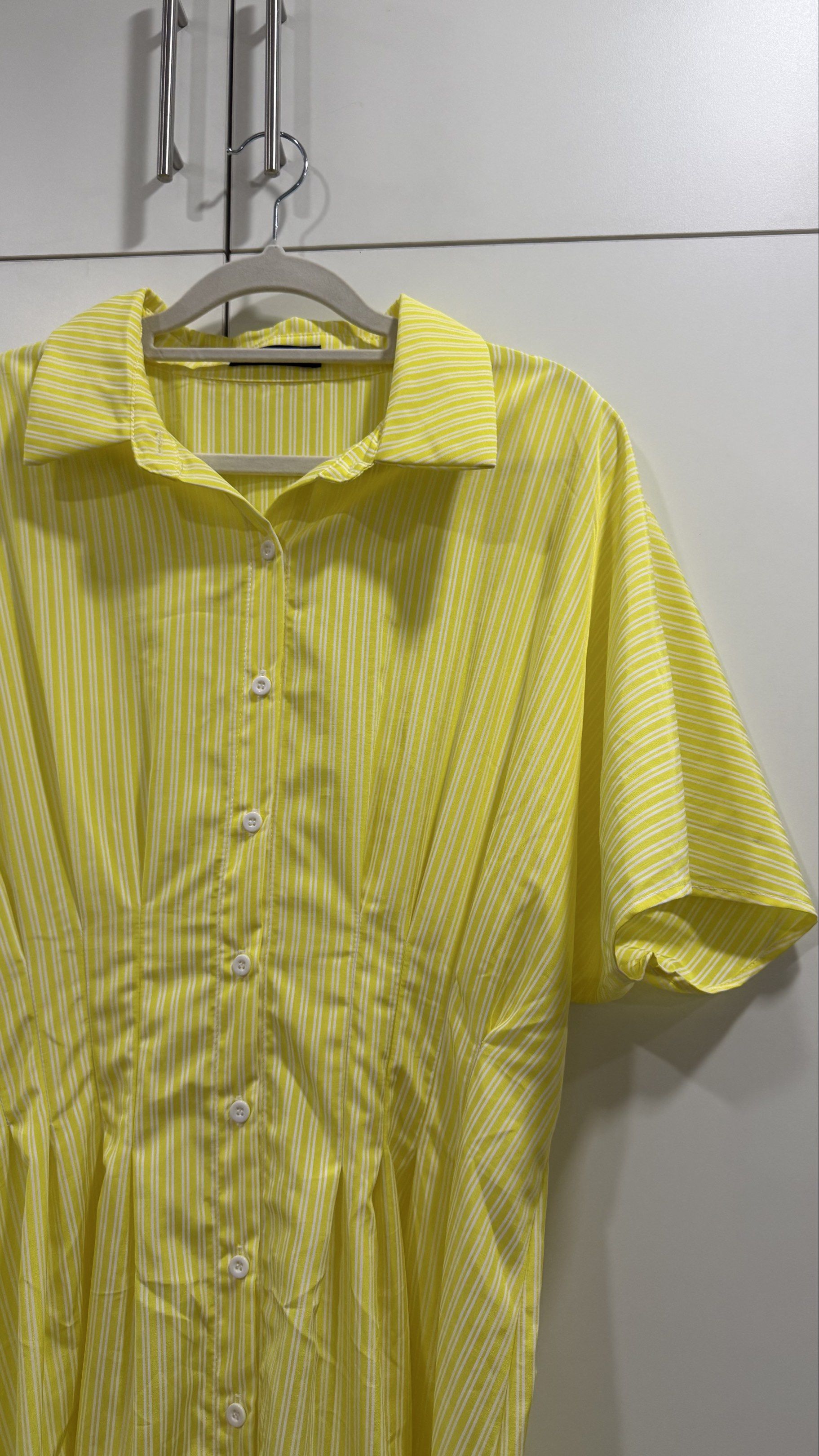 Striped Yellow Batwing A Line Dress (Category: Dresses) located in Quezon City. Submitted by gnvc00 (Listing ID 1420756281, Image 2). Description: Worn ONCE - Yellow midi dress - Striped pattern - Collared neckline - Button-down front - batwing sleeves - Pleated waist - Size: XL Bust: 40.6 inches Waist: 36.2 inches Hips: 57.2 inches Length: 50-51.5 inches Sleeve Length: 13.9 inches Cuff: 19.4 inches.