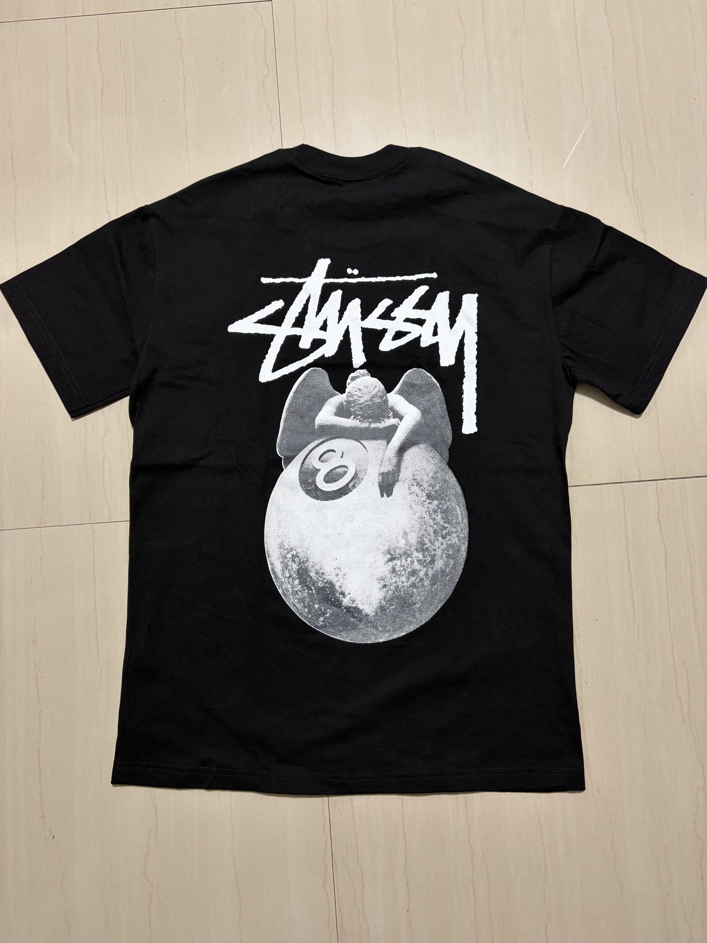 Stussy Angel 8 Ball Tee - Black (Category: Tshirts & Polo Shirts ) located in Cavite. Submitted by _dashhh (Listing ID 1420746997, Image 2). Description: - Size: S - Used once - Bought from Taiwan (Not Orig) - Width - 20 Length - 29 - Rfs: too big for me .