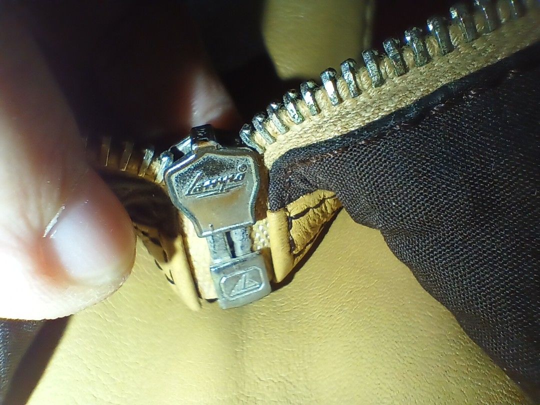 Tod's Genuine Leather Shoulder Bag (Category: Luxury Bags & Wallets) located in Quezon City. Submitted by threetwotwo2ndaccount (Listing ID 1420801691, Image 3). Description: - Authentic Tod's shoulder bag - Tan leather exterior - Secure zipper closure - Interior lined with dark fabric - Made in Italy - Features the Tod's logo - Genuine Lampo zipper size: H-11",L-19",W-6" issue: putol ung zipper puller no inclusion .