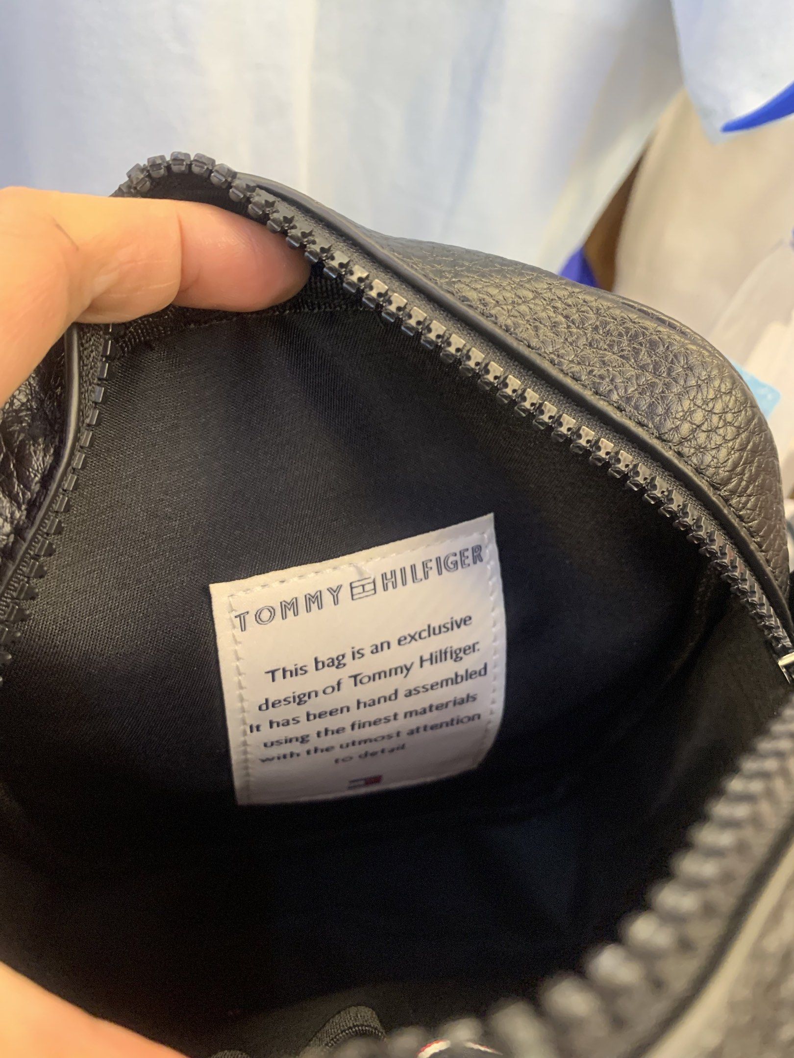 Tommy Hilfiger Black Crossbody Bag (Category: Cross-body Bags) located in Quezon City. Submitted by applelux (Listing ID 1420798934, Image 2). Description: - Black Tommy Hilfiger crossbody bag - Main compartment with zipper closure - Additional front pocket - Detachable and adjustable shoulder strap - Tommy Hilfiger logo on the front - Small logo detail on zipper pull - Interior zippered pocket.