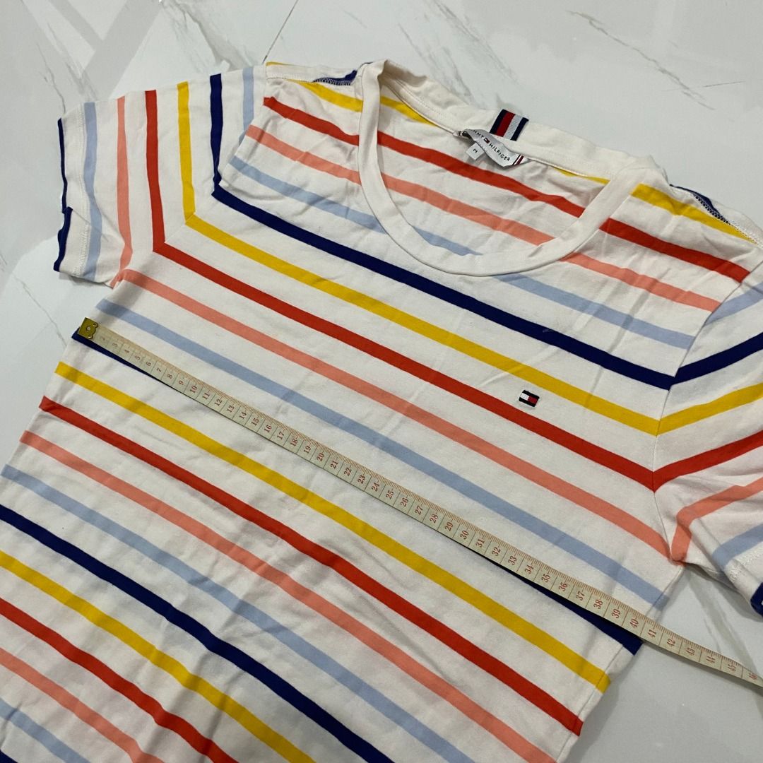 Tommy Hilfiger Striped T-shirt (Category: Others Tops) located in San Fernando. Submitted by deku_off (Listing ID 1420889361, Image 2). Description: - Tommy Hilfiger striped t-shirt - Crew neck - Short sleeves - Features the Tommy Hilfiger logo - Made of soft, comfortable material - Versatile for casual wear.