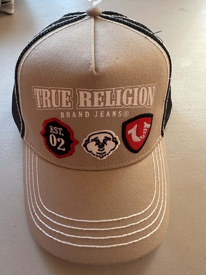 True Religion Brand Jeans Cap (Category: Caps & Hats) located in Baguio. Submitted by miraclul7 (Listing ID 1420780265, Image 1). Description: - Authentic True Religion cap - Features the True Religion logo - Color: Mushroom - Style: TR4914 - Size: OS (One Size) - Mesh back and curved brim - Original Price: $69.00.