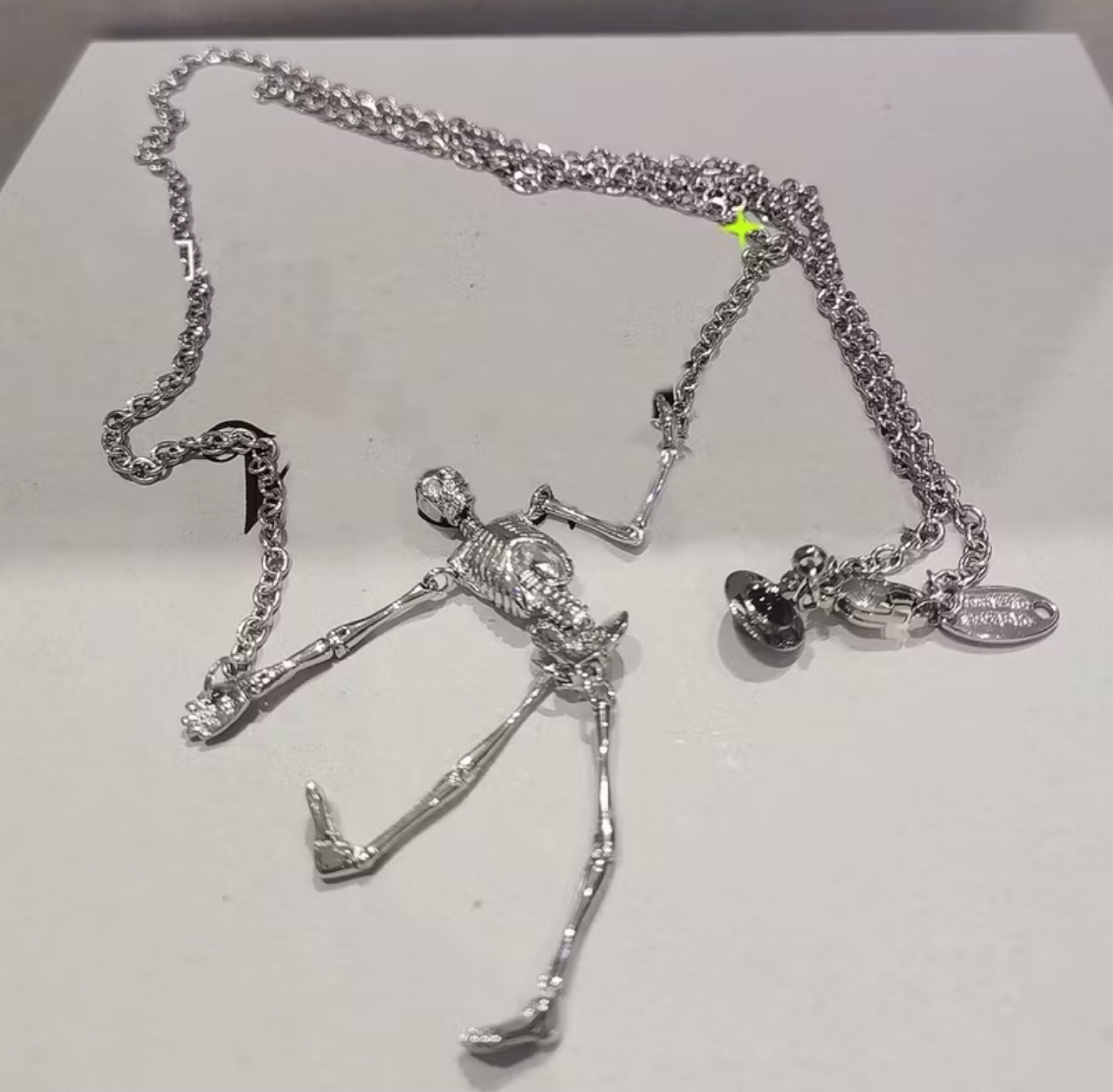 Vivienne Westwood Skeleton Necklace (Category: Luxury Accessories) located in Calamba. Submitted by apppp_117 (Listing ID 1420915372, Image 1). Description: - Vivienne Westwood Skeleton Necklace - Unique and eye-catching design - Features intricate skeleton detailing - A luxury accessory - Perfect for unisex wear - Unique and eye-catching design - Pre-order item - Shipping time: 7-14 days - Unique and eye-catching design - Pre-order item - Shippi