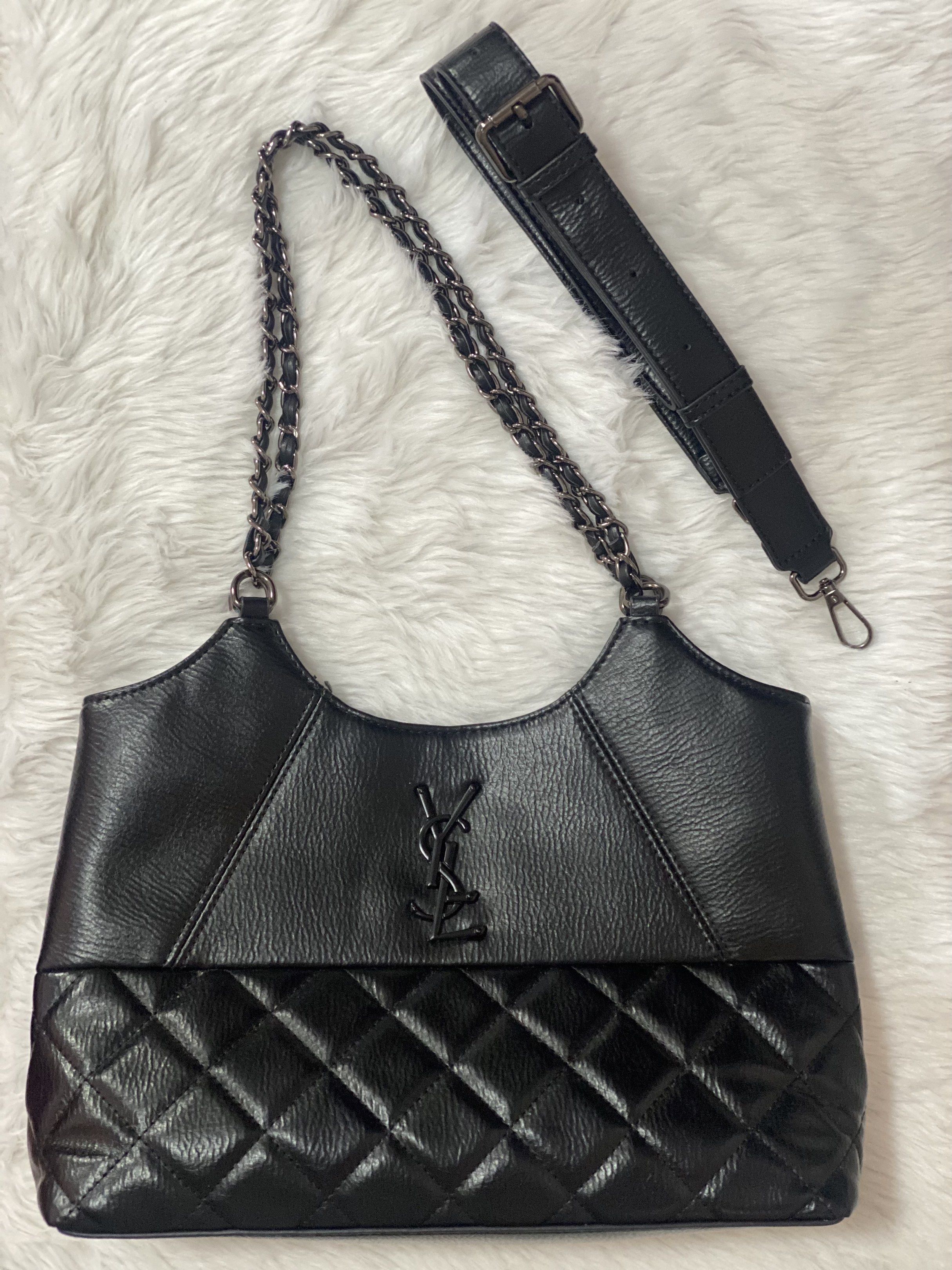 YSL Black Shoulder Bag with Chain Strap (Category: Luxury Bags & Wallets) located in Taguig. Submitted by prelobyjen (Listing ID 1420784620, Image 2). Description: - Black shoulder bag - Chain strap and adjustable strap included - Quilted design on the bottom - Features the YSL logo - Multiple interior compartments with zipper closures - Detachable shoulder strap for different carrying styles - Not orig so price is slightly negotiable.