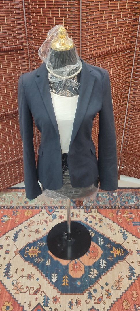 Zara Basic Navy Blazer (Category: Coats, Jackets and Outerwear) located in Selayang. Submitted by dee_rich (Listing ID 1420869722, Image 2). Description: - Zara Basic navy blazer - Classic design with notched lapel - Two-button closure - Interior lining with dotted pattern - Tailored fit - Suitable for casual and semi-formal occasions.